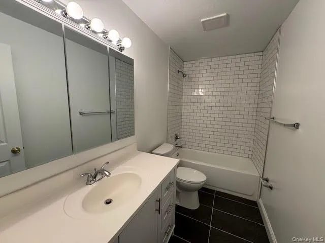 Full bathroom with a tub. Full bathroom with a tub.