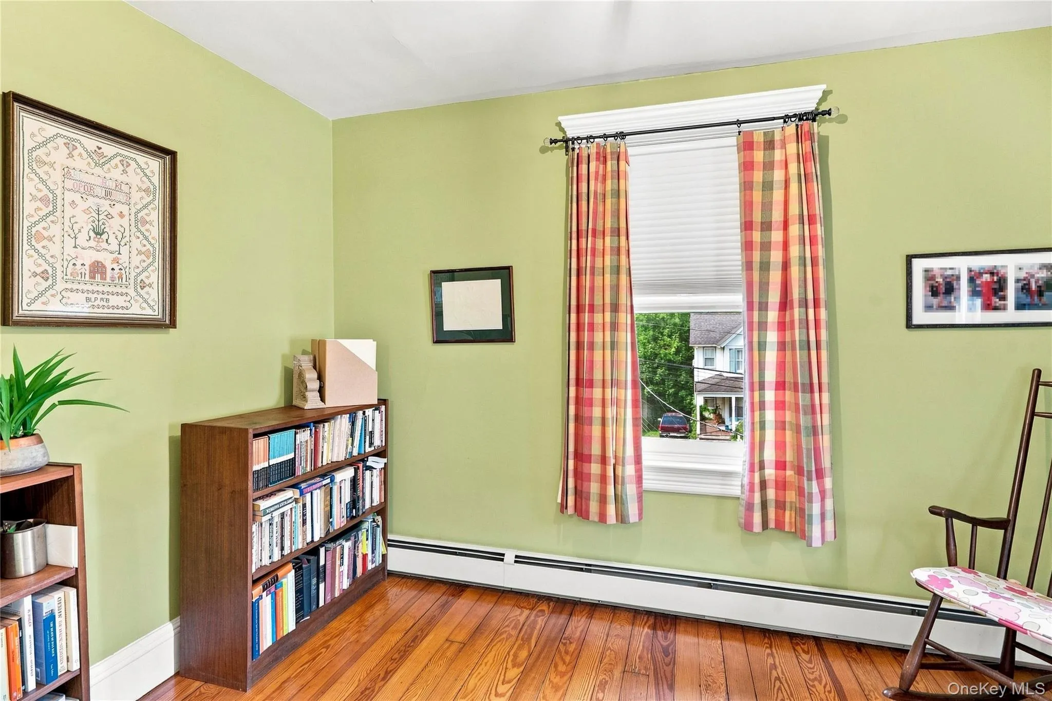 Hardwood flooring, painted walls, white trim, and a window with cornice Hardwood flooring, painted walls, white trim, and a window with cornice