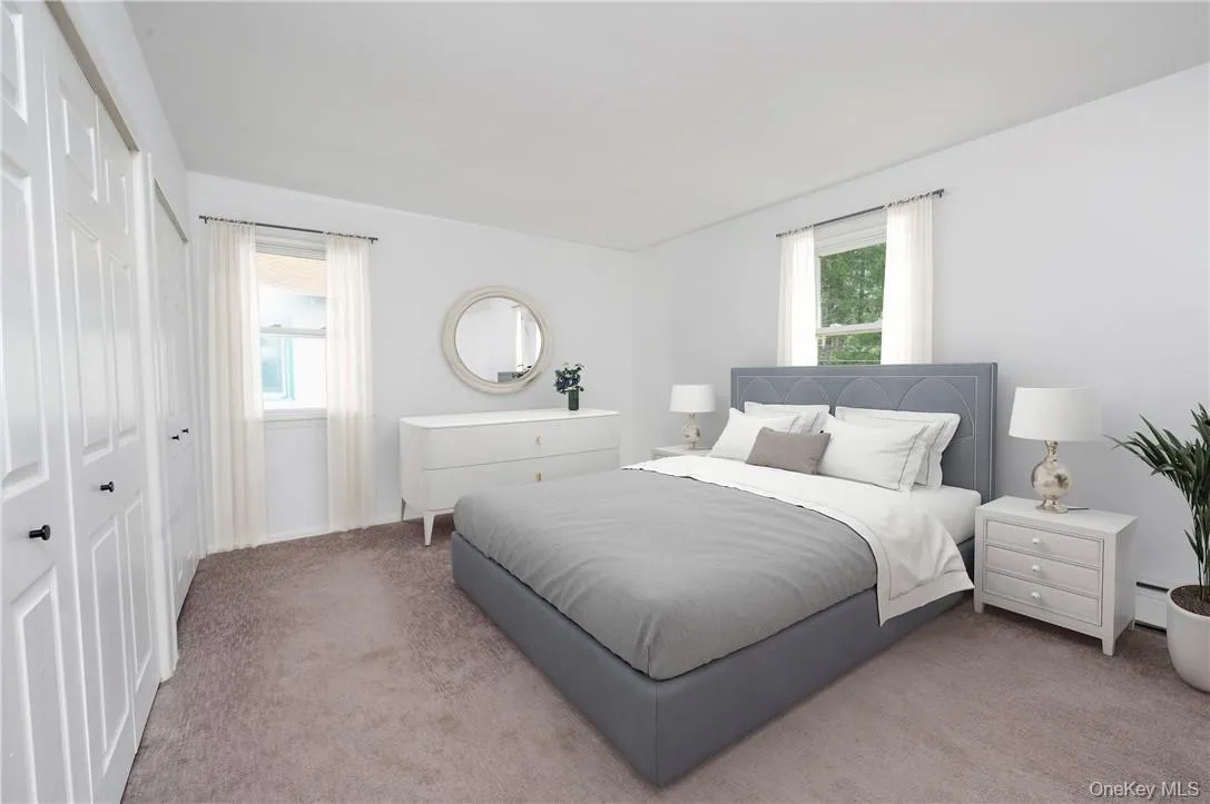 Virtually staged primary bedroom on second floor. Virtually staged primary bedroom on second floor.