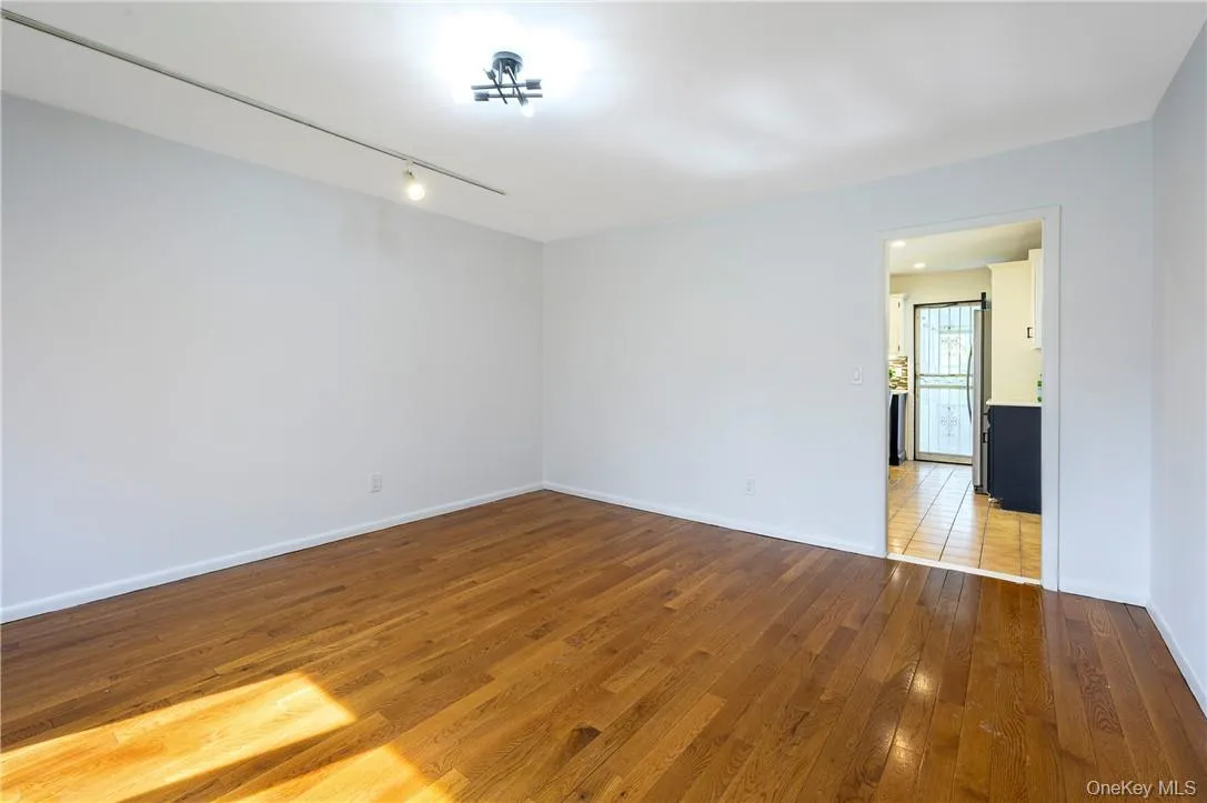 A bright and sunny dining room with view of the kitchen, A bright and sunny dining room with view of the kitchen,