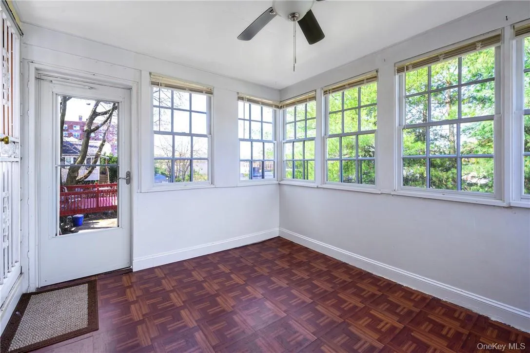 Sunroom off the kitchen with the door that leads to backyard. Sunroom off the kitchen with the door that leads to backyard.