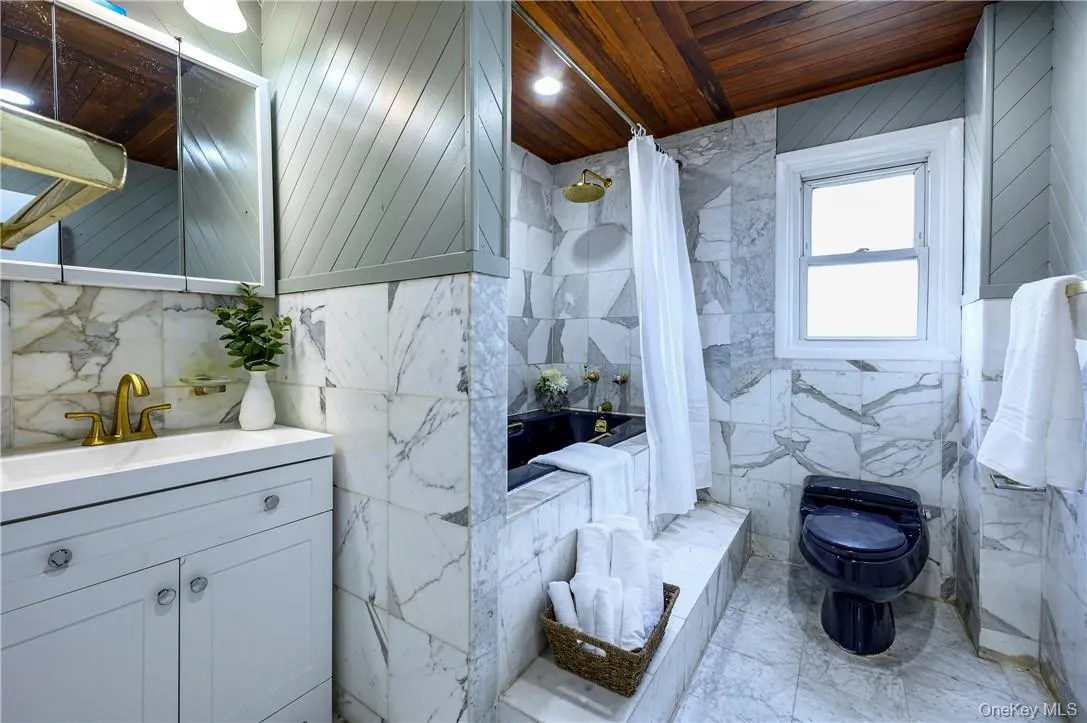 Hall bathroom on second floor with a soaking tub. Hall bathroom on second floor with a soaking tub.