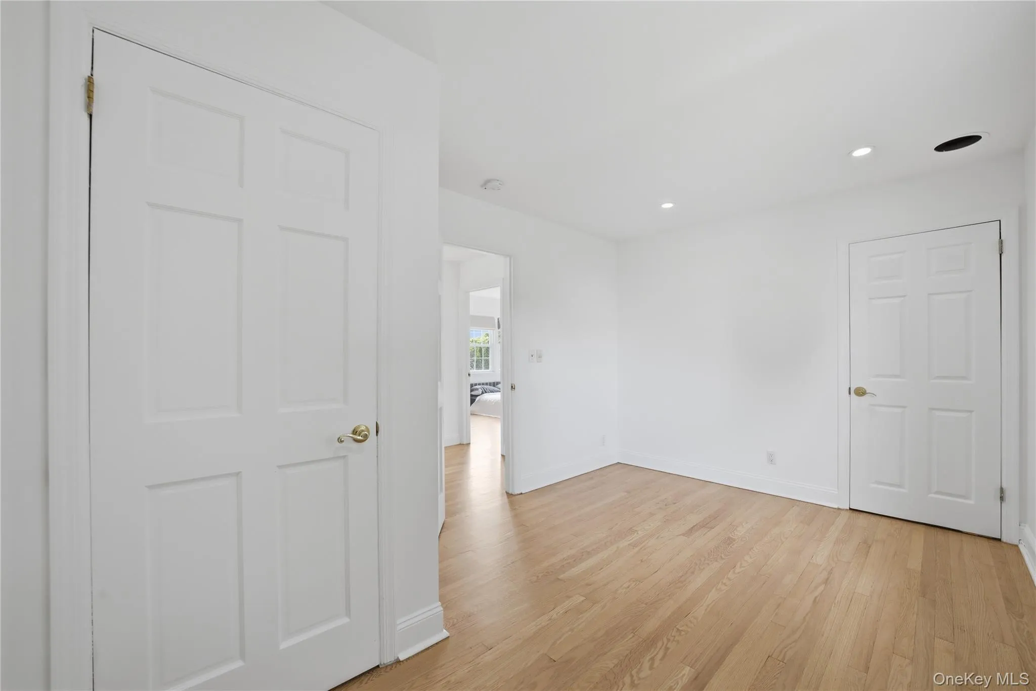 3rd bedroom with door leading up stairs to the attic. 3rd bedroom with door leading up stairs to the attic.