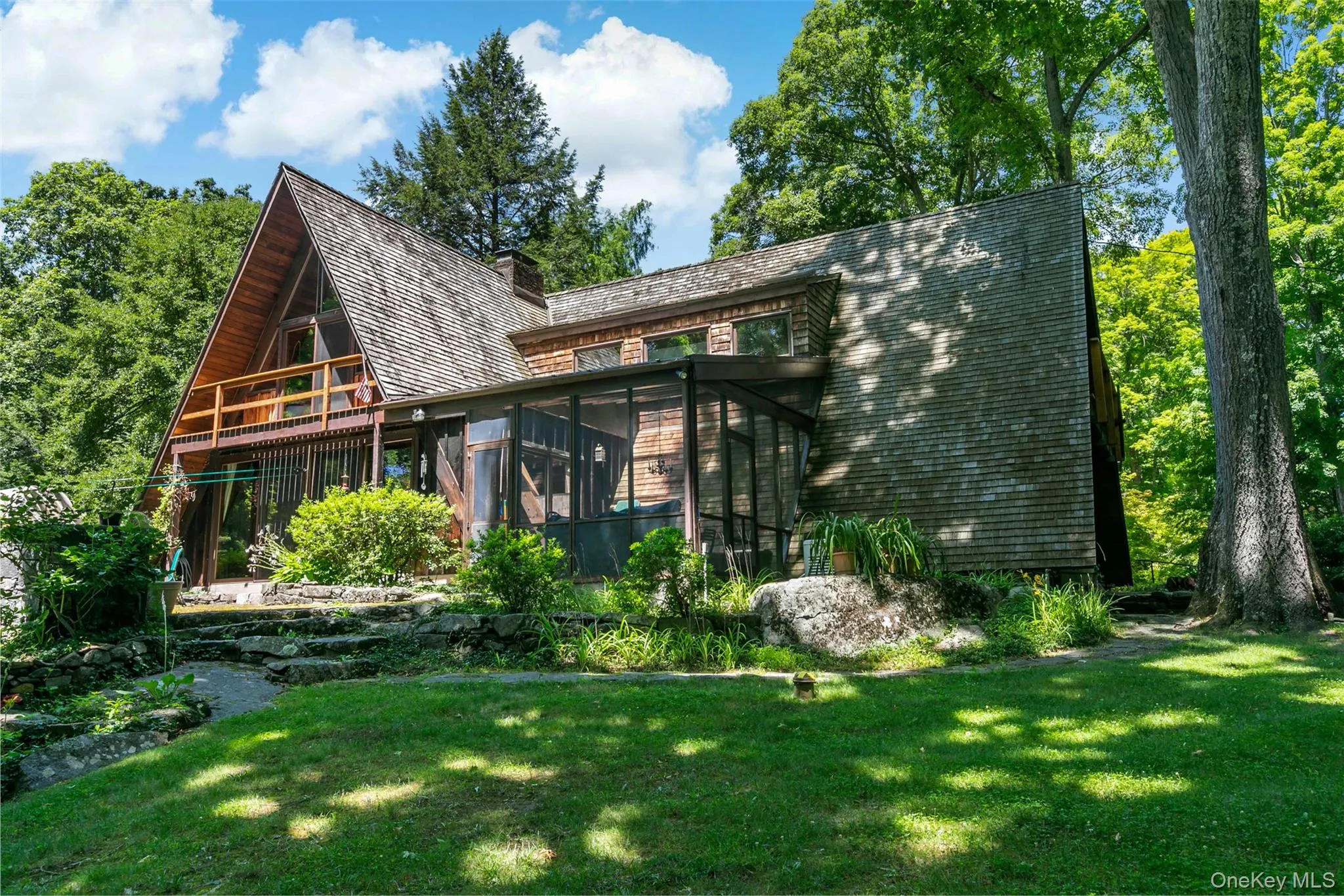 Three outdoor spaces in one photo. Second story deck off third bedroom, screened in porch and terrace. Three outdoor spaces in one photo. Second story deck off third bedroom, screened in porch and terrace.