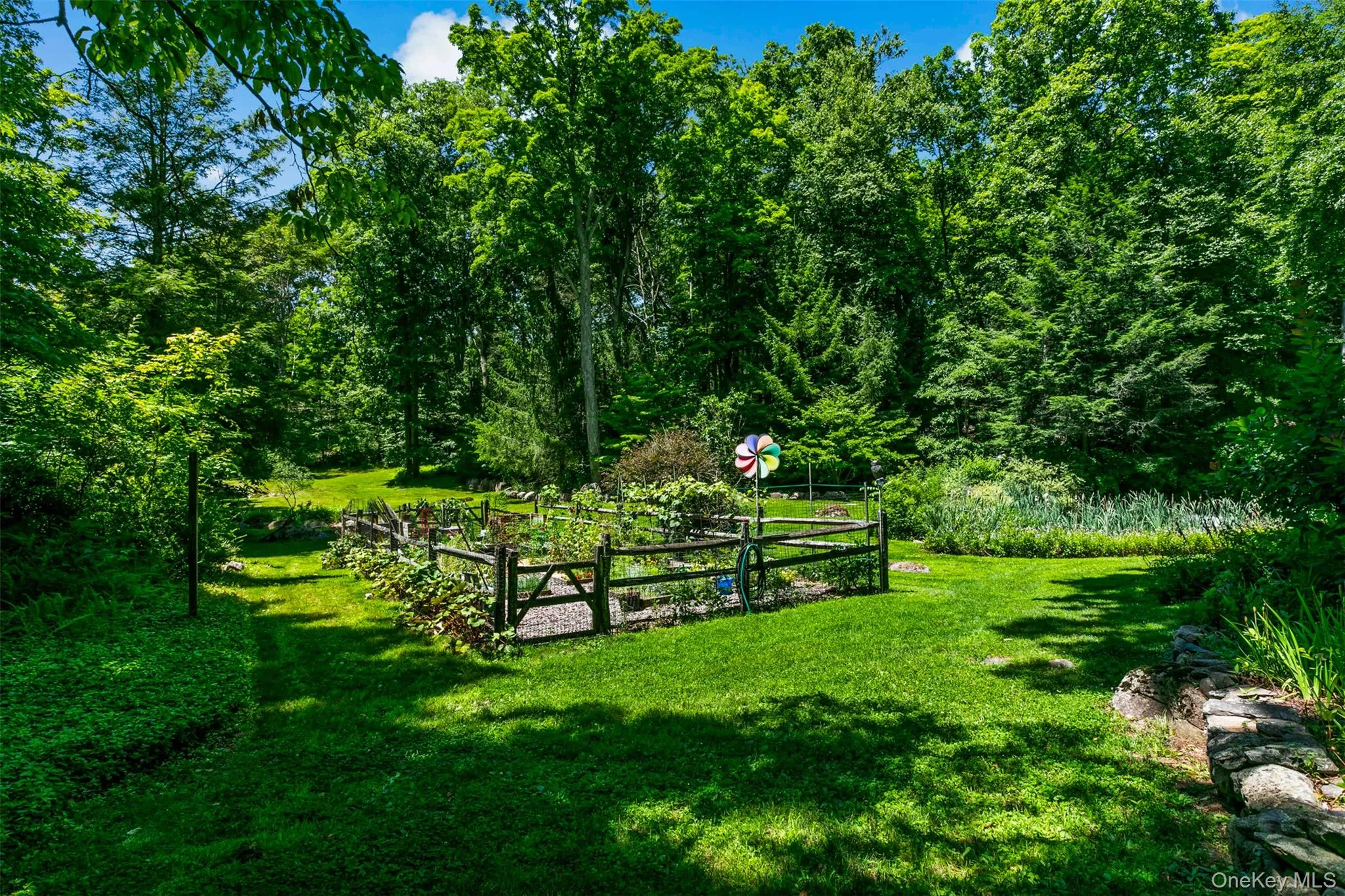 Fenced in vegetable and flower garden. Fenced in vegetable and flower garden.