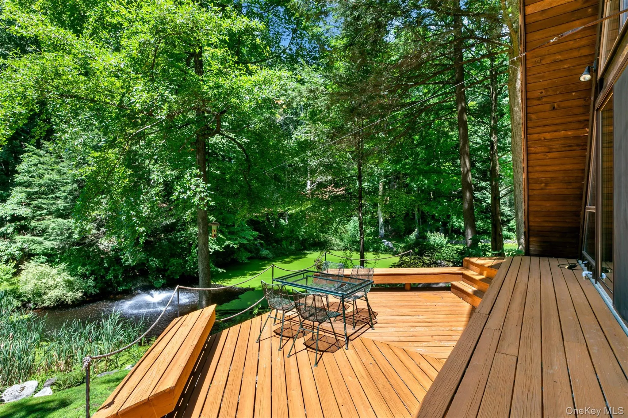 Great room deck overlooking pond and acres beyond. Great room deck overlooking pond and acres beyond.