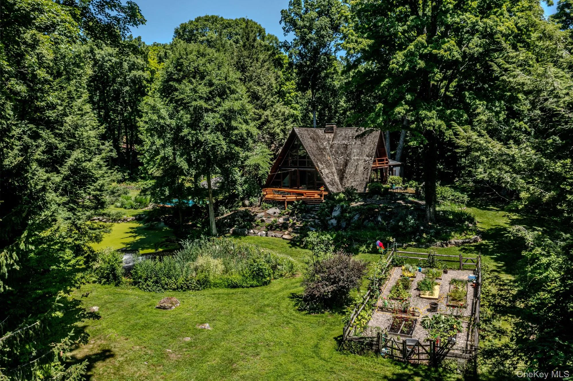 Aerial photo showing fenced in garden and pond. Aerial photo showing fenced in garden and pond.