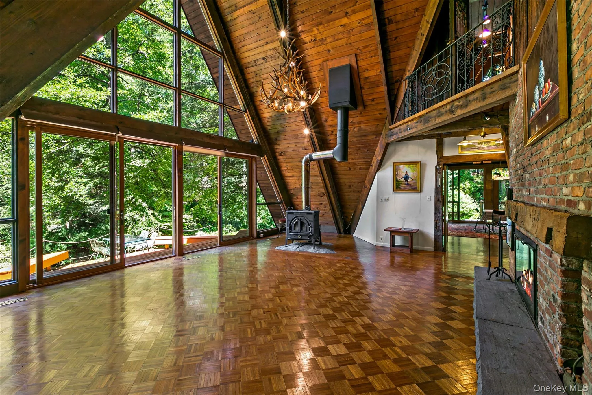 Another angle of the great room showing second story perch overlooking it all. Another angle of the great room showing second story perch overlooking it all.