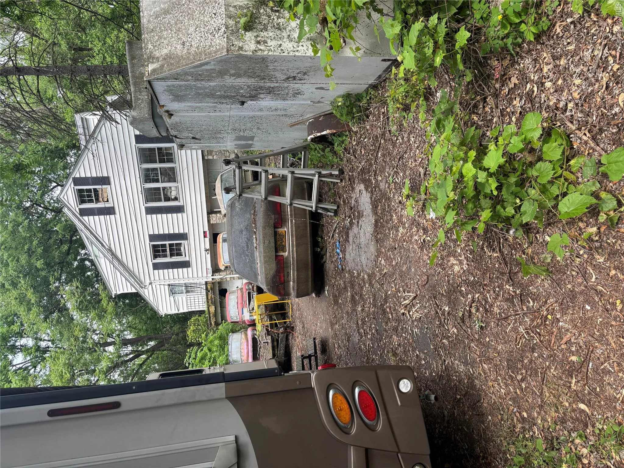 Home sits on property with side facing driveway. Home sits on property with side facing driveway.