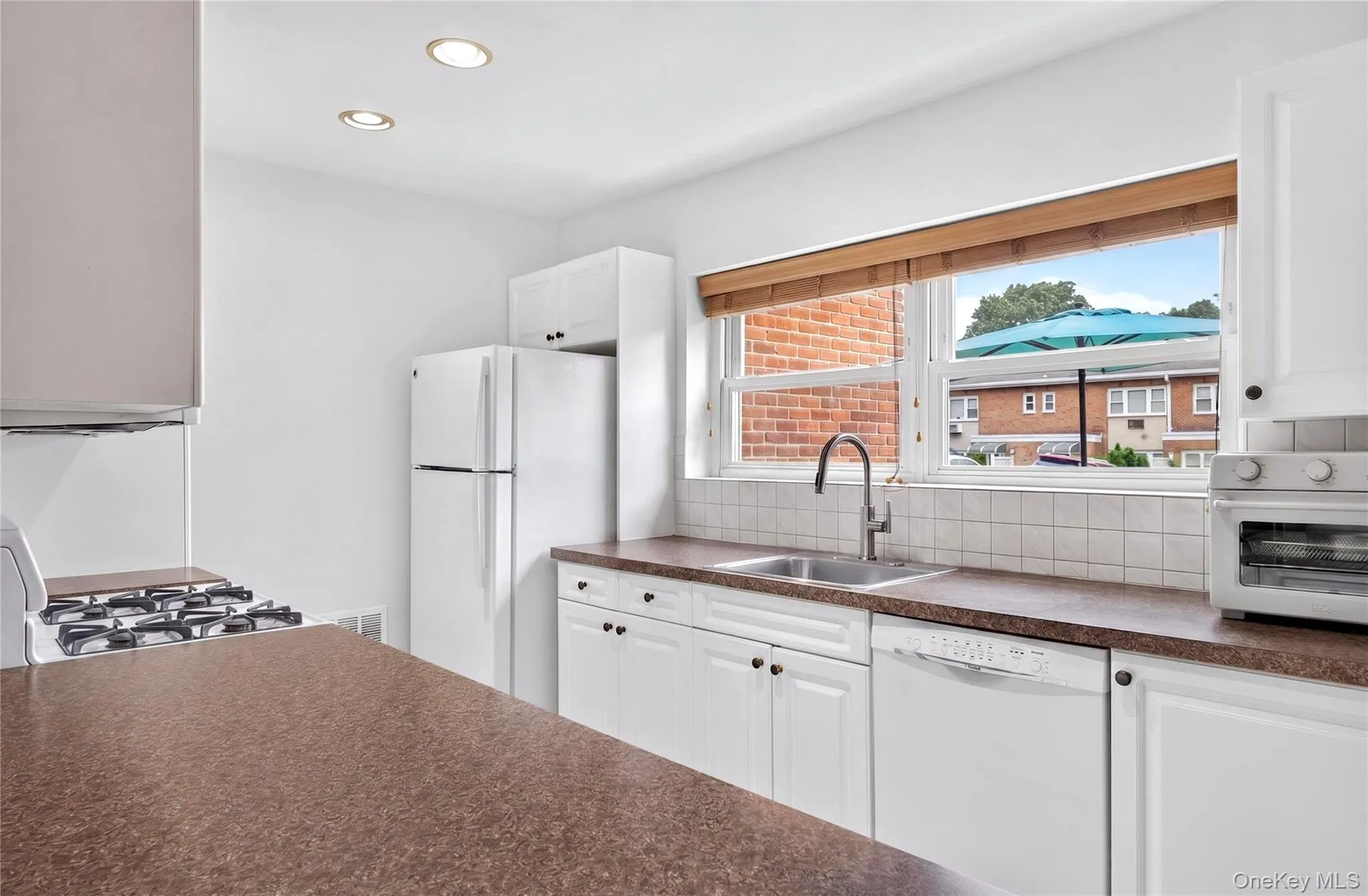 Newer kitchen with gas range, dishwasher and fridge. Newer kitchen with gas range, dishwasher and fridge.