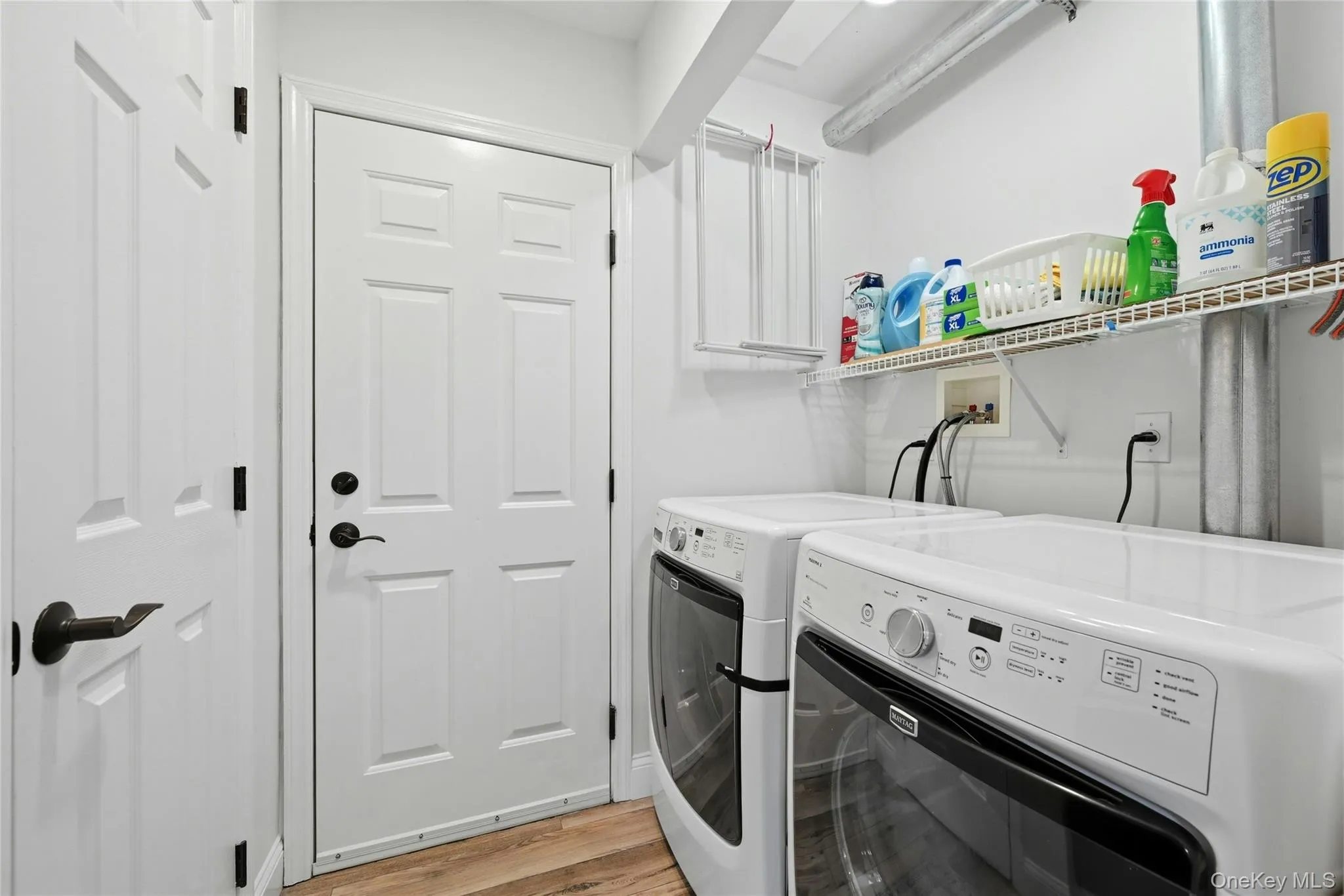 Laundry area with entrance to garage Laundry area with entrance to garage