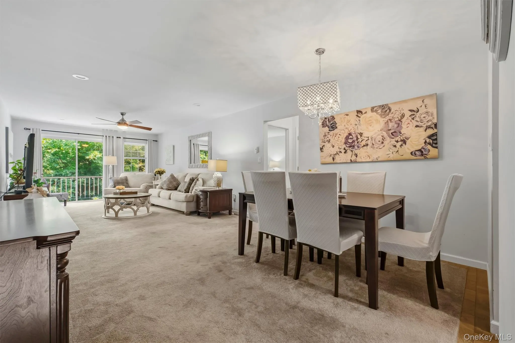 Spacious, sun filled living room and dining room. Spacious, sun filled living room and dining room.