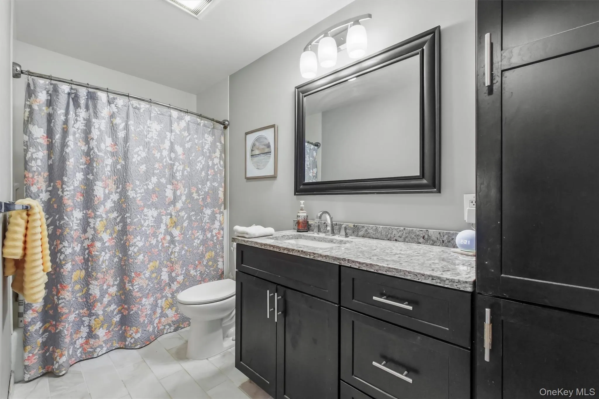 Large, updated custom bathroom with storage closet. Large, updated custom bathroom with storage closet.