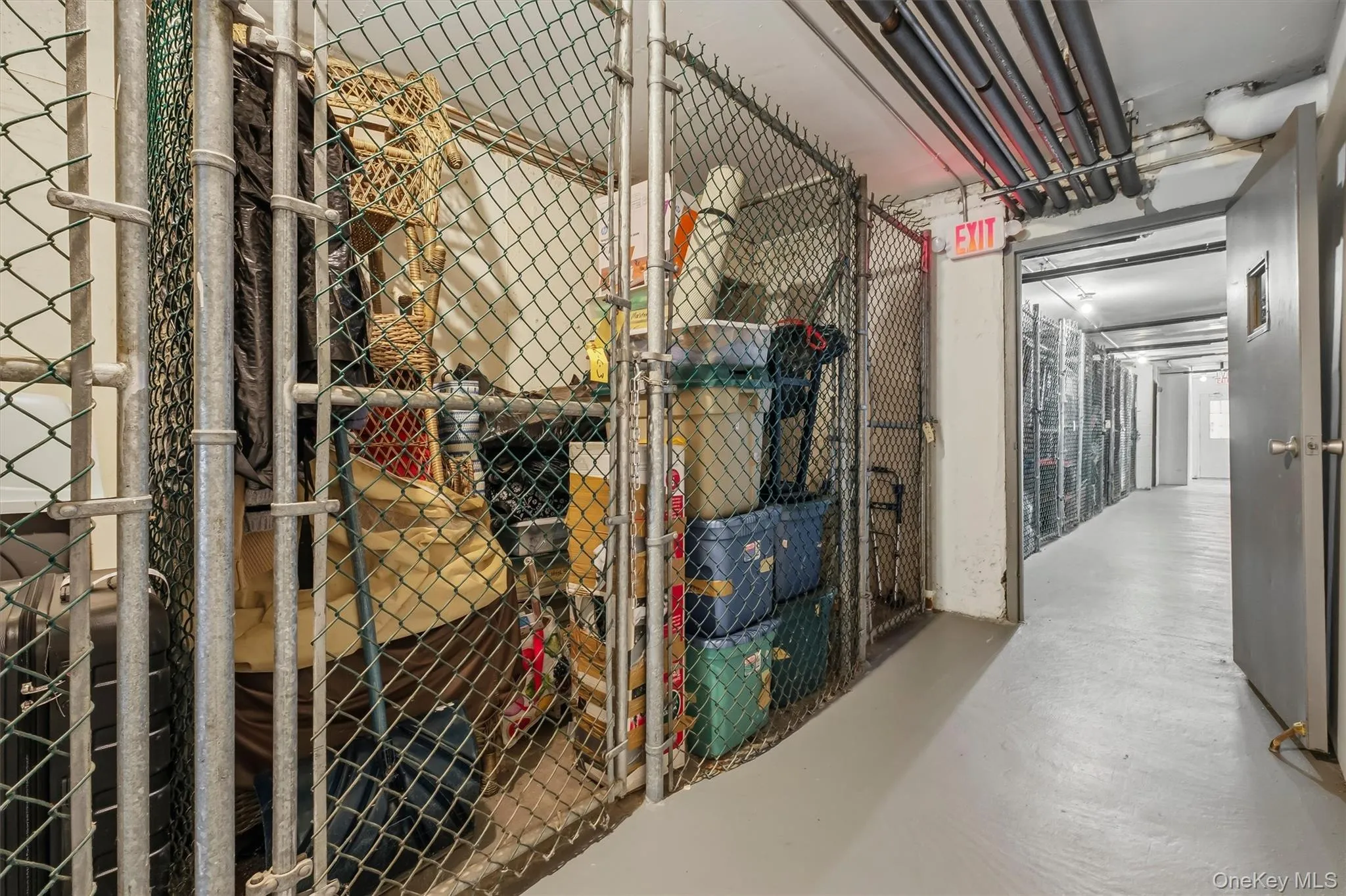 Large locked storage area in basement. Large locked storage area in basement.