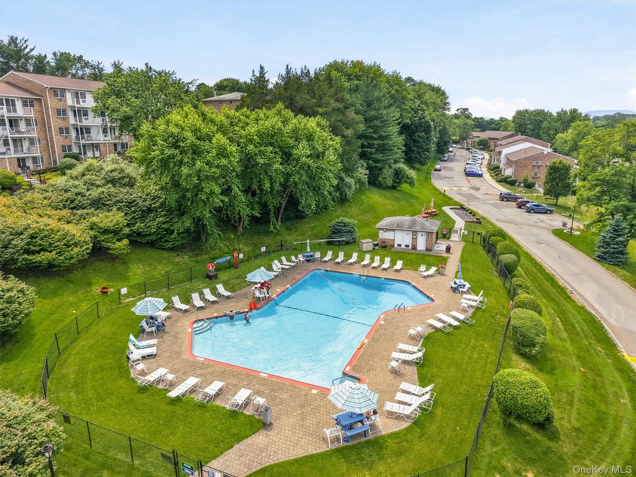 Enjoy summer days at the community pool with BBQ are and picnic tables. Enjoy summer days at the community pool with BBQ are and picnic tables.
