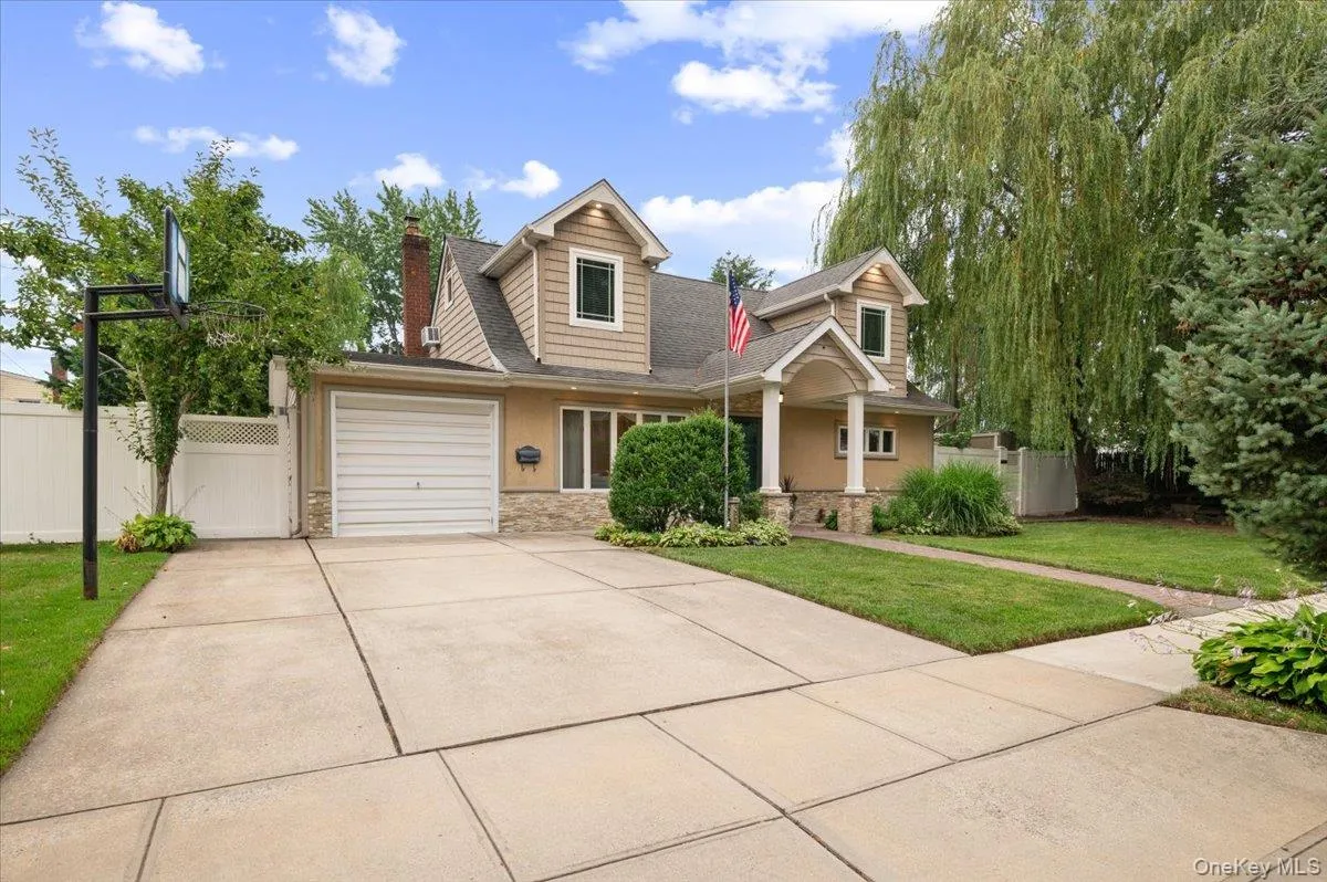 Custom Oversized Portico Welcomes you into this Unique Home while the Double Driveway has enough room for four cars or plenty of on street parking for a pickup game of basketball. Custom Oversized Portico Welcomes you into this Unique Home while the Double Driveway has enough room for four cars or plenty of on street parking for a pickup game of basketball.