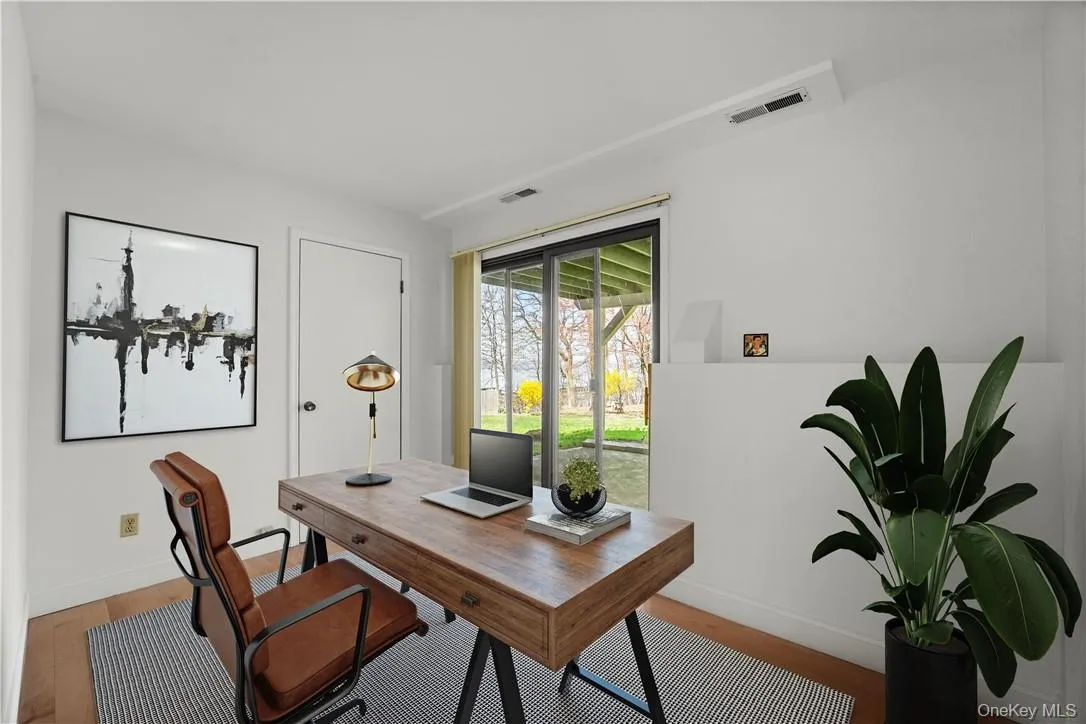Virtually staged home office/den. Virtually staged home office/den.