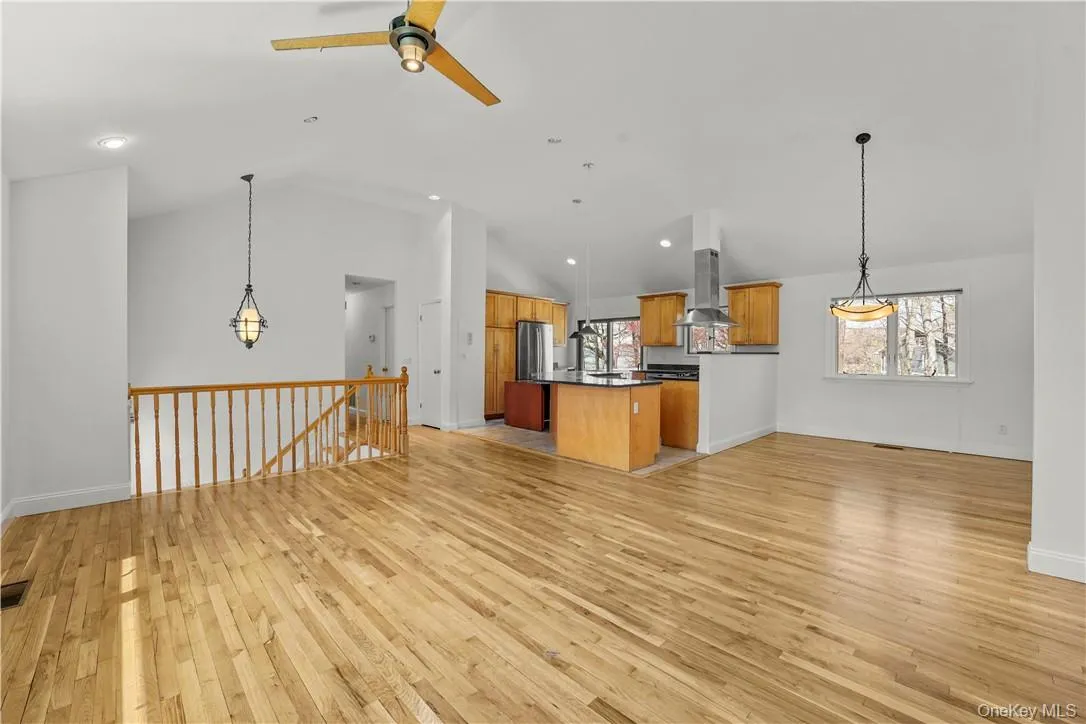 View of Living Room, Dining Room and Kitchen. Hard wood floors have been polished and wall freshly painted. View of Living Room, Dining Room and Kitchen. Hard wood floors have been polished and wall freshly painted.