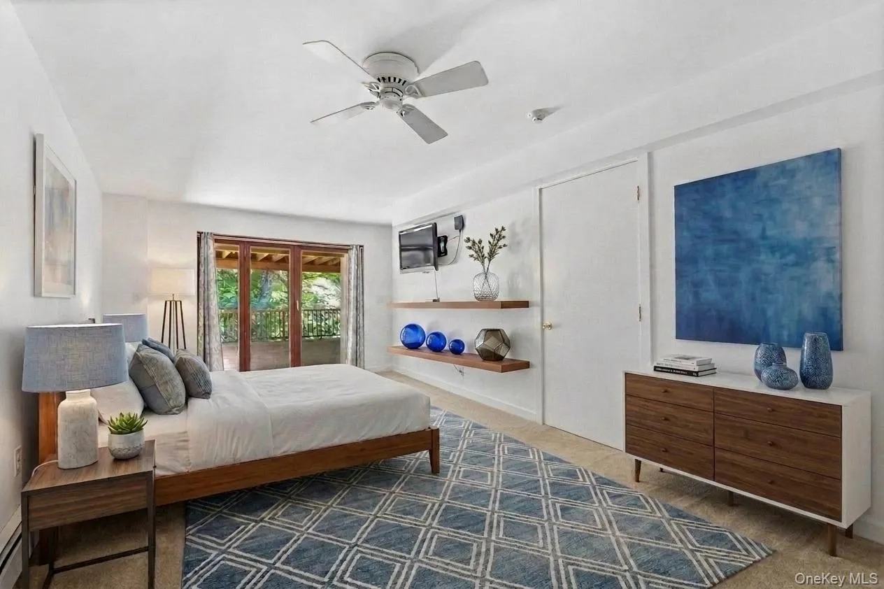 Located on the lower level, this bedroom has been virtually staged to showcase the warmth and charm of the space—an inviting retreat ideal for guests or multigenerational living. Located on the lower level, this bedroom has been virtually staged to showcase the warmth and charm of the space—an inviting retreat ideal for guests or multigenerational living.