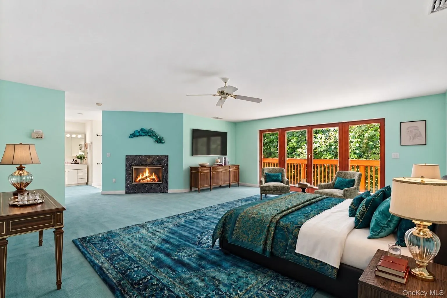 Virtually staged to highlight its generous proportions, the primary bedroom is filled with inviting color, natural light, and warmth, creating a serene and welcoming retreat with ample space for a comfortable sitting or lounging area. Virtually staged to highlight its generous proportions, the primary bedroom is filled with inviting color, natural light, and warmth, creating a serene and welcoming retreat with ample space for a comfortable sitting or lounging area.