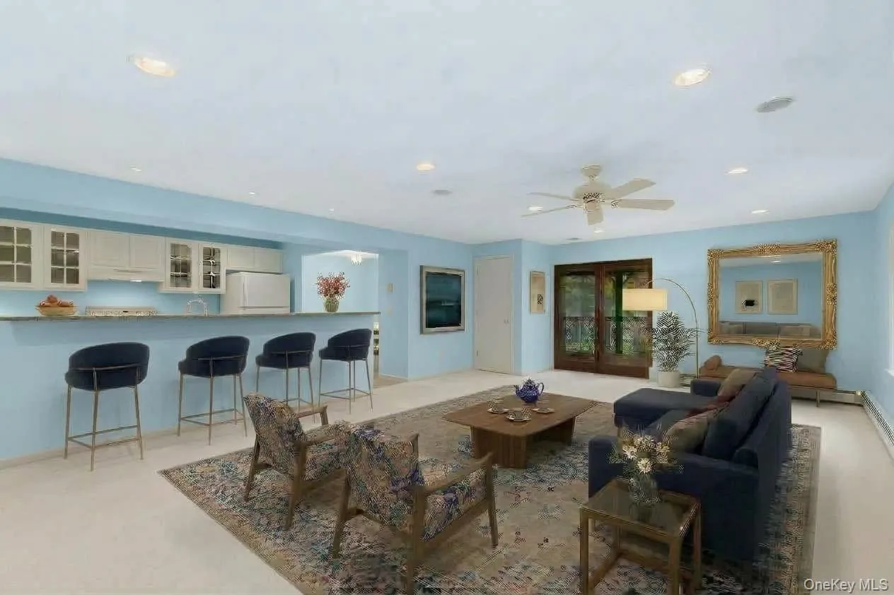 Virtually staged to showcase the lower-level living space as a warm and welcoming setting for gathering, entertaining, and relaxing. Virtually staged to showcase the lower-level living space as a warm and welcoming setting for gathering, entertaining, and relaxing.
