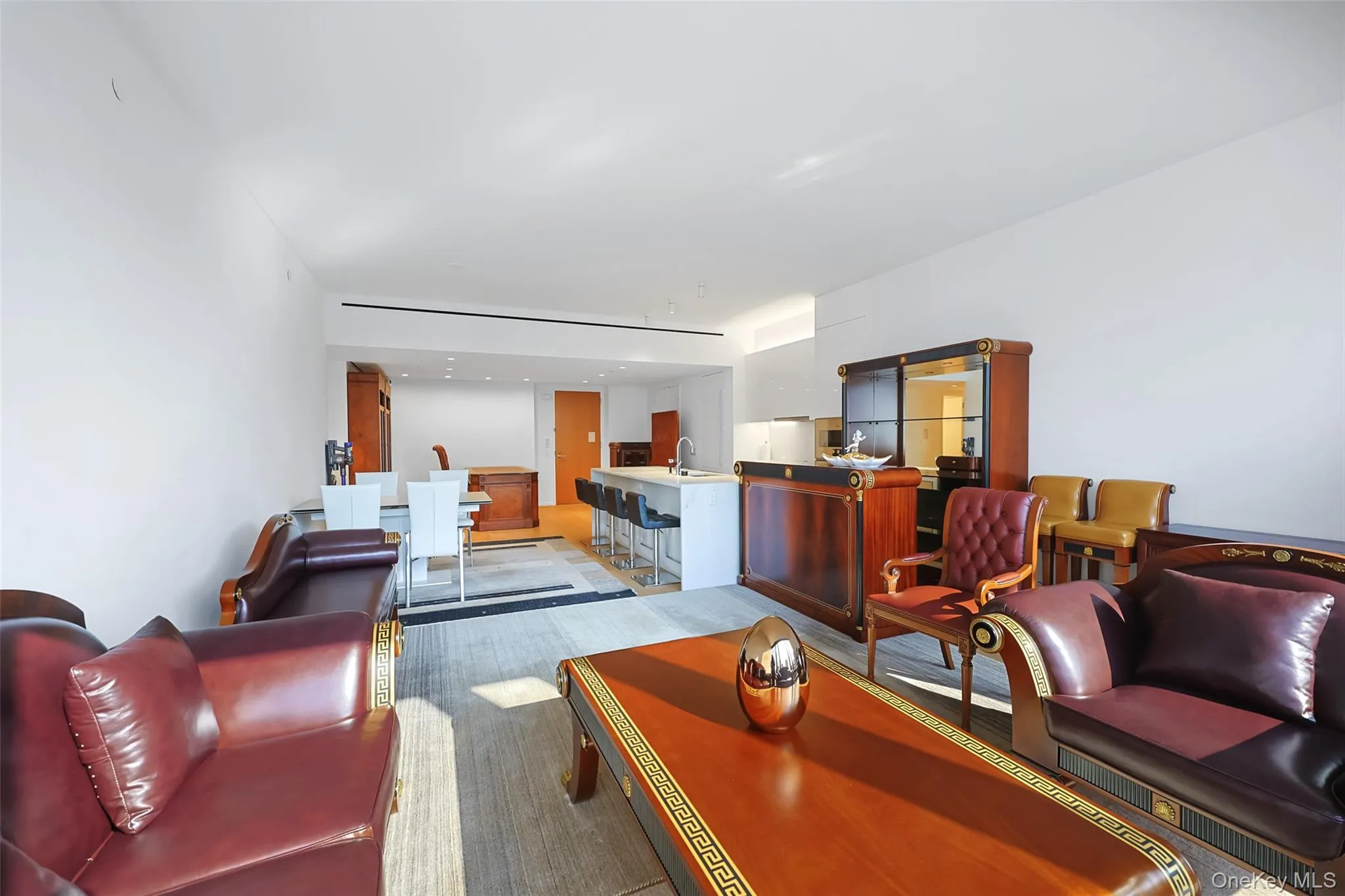 Open-concept living space featuring wood-finish flooring, From Kitchen and Living Room Open-concept living space featuring wood-finish flooring, From Kitchen and Living Room