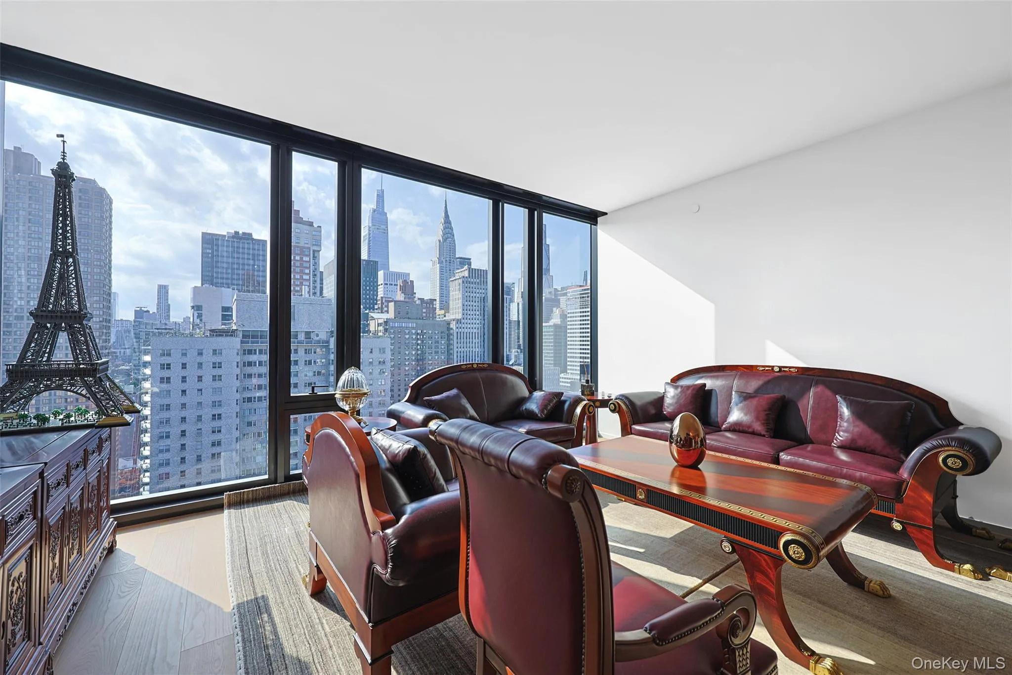Floor-to-ceiling windows with expansive city scenery Floor-to-ceiling windows with expansive city scenery