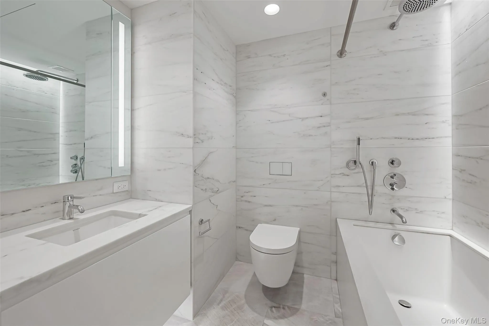 Secondary Bedroom Ensuite bathroom. Spa-inspired bathrooms feature Blue de Savoie stone floors, Calacatta Lincoln marble wallsand meticulously crafted custom fixtures and finishes Secondary Bedroom Ensuite bathroom. Spa-inspired bathrooms feature Blue de Savoie stone floors, Calacatta Lincoln marble wallsand meticulously crafted custom fixtures and finishes