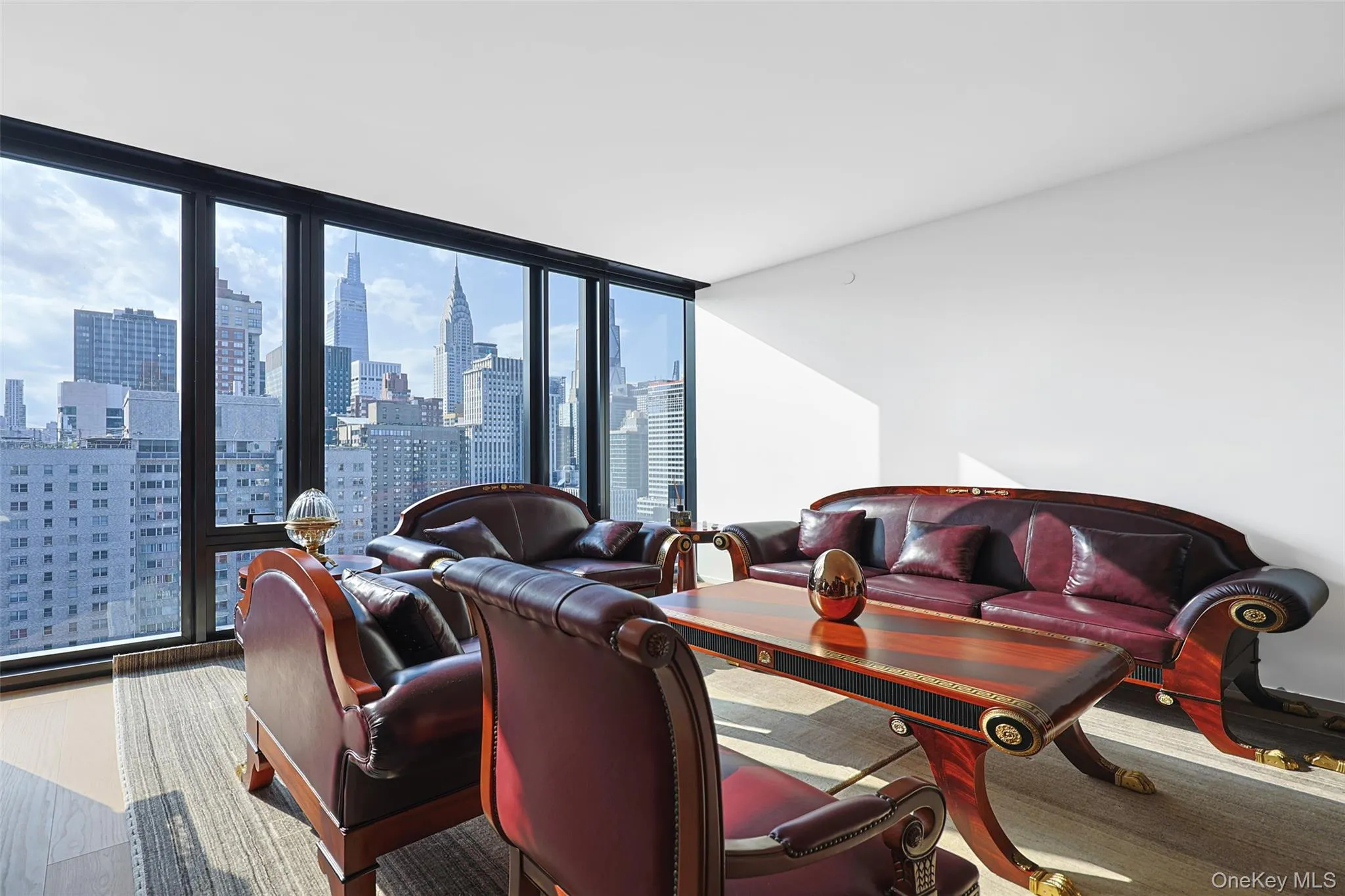 Floor-to-ceiling windows with expansive city scenery Floor-to-ceiling windows with expansive city scenery