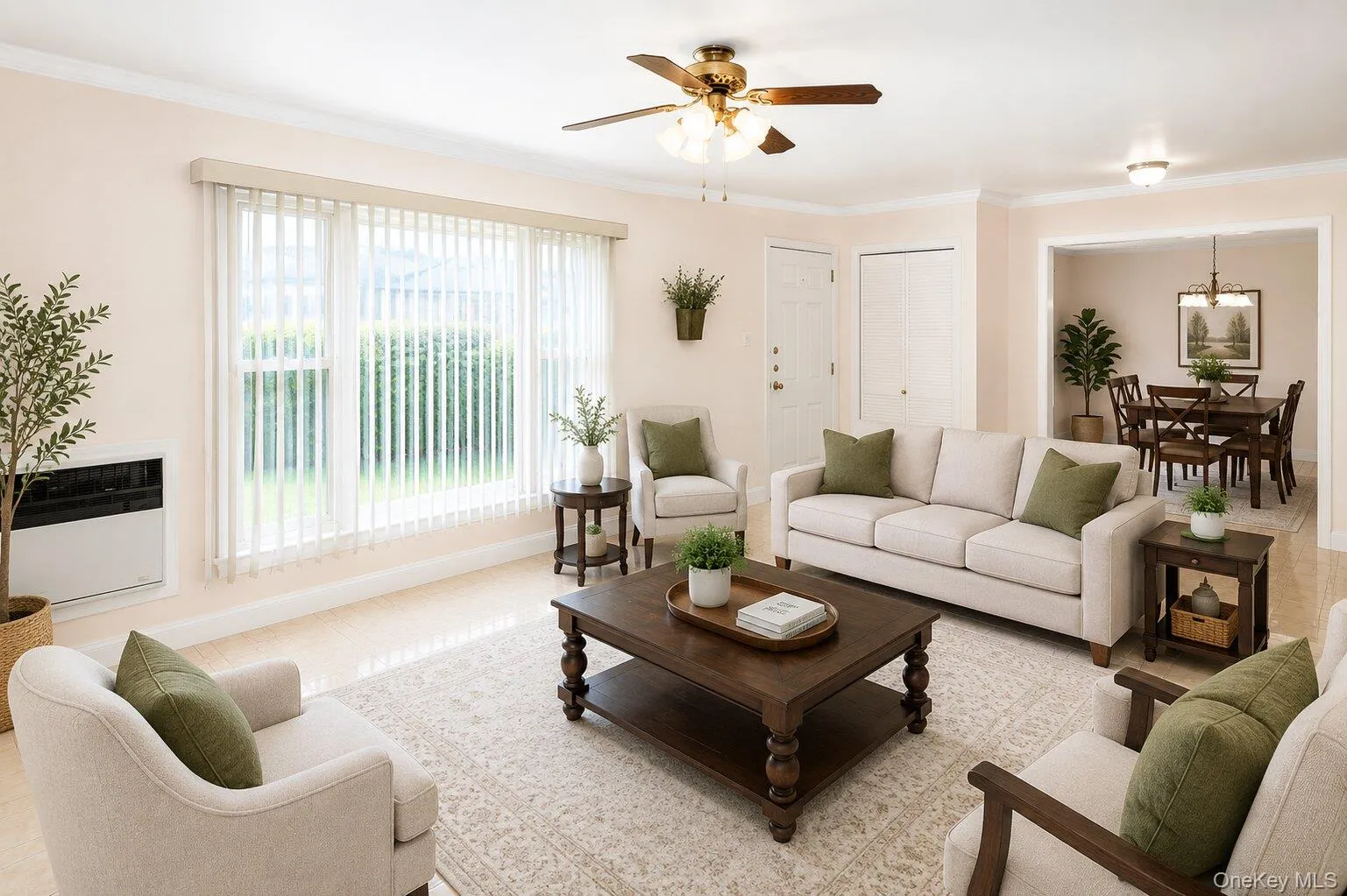 VIRTUALLY STAGED. Spacious living area featuring light-toned tile flooring and a ceiling fan VIRTUALLY STAGED. Spacious living area featuring light-toned tile flooring and a ceiling fan