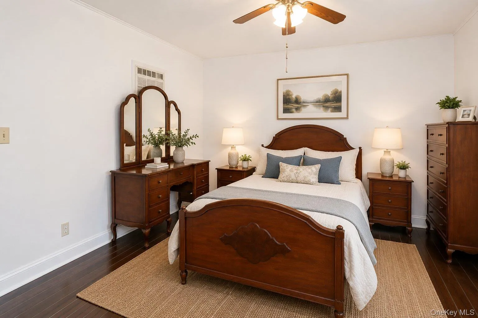 Hardwood-finish flooring, white painted walls, and crown molding Hardwood-finish flooring, white painted walls, and crown molding