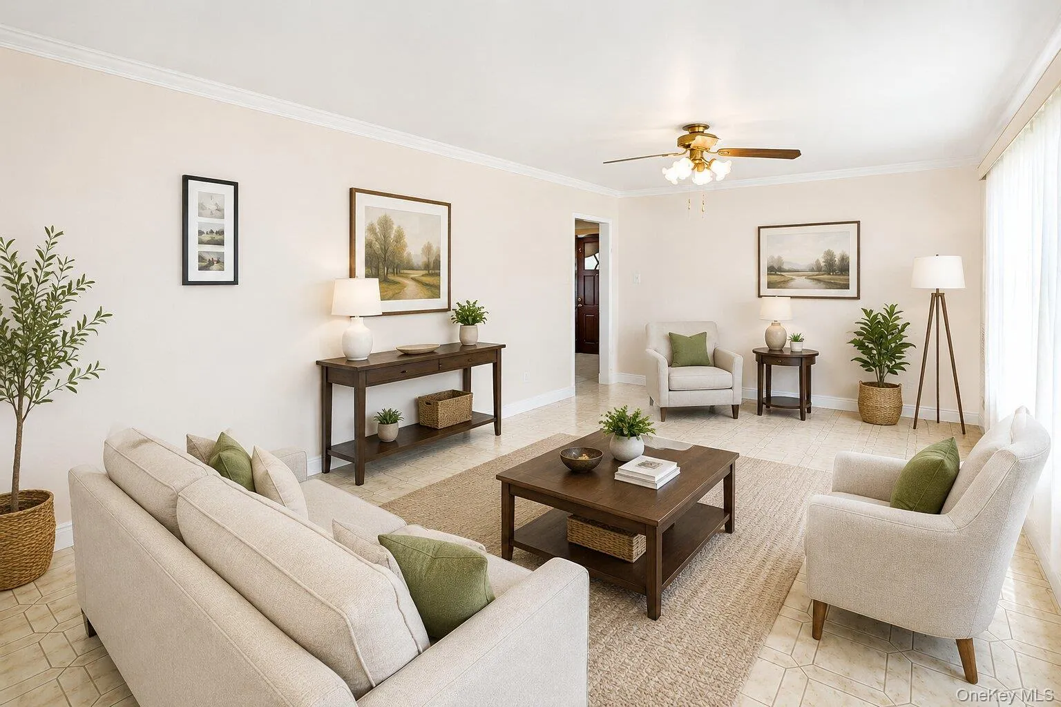 VIRTUALLY STAGED. Spacious living area featuring light-toned walls, crown molding, and tiled flooring VIRTUALLY STAGED. Spacious living area featuring light-toned walls, crown molding, and tiled flooring