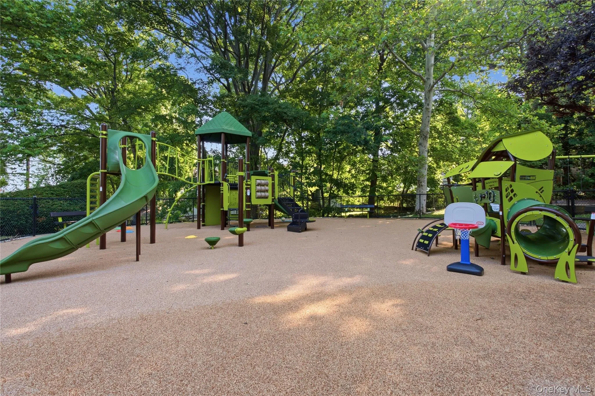 Expansive outdoor playground featuring a rubberized safety surface Expansive outdoor playground featuring a rubberized safety surface