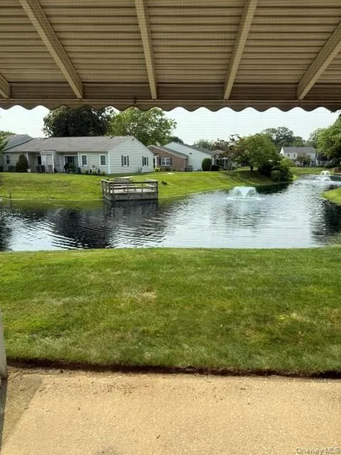 Covered patio with lagoon view. Covered patio with lagoon view.