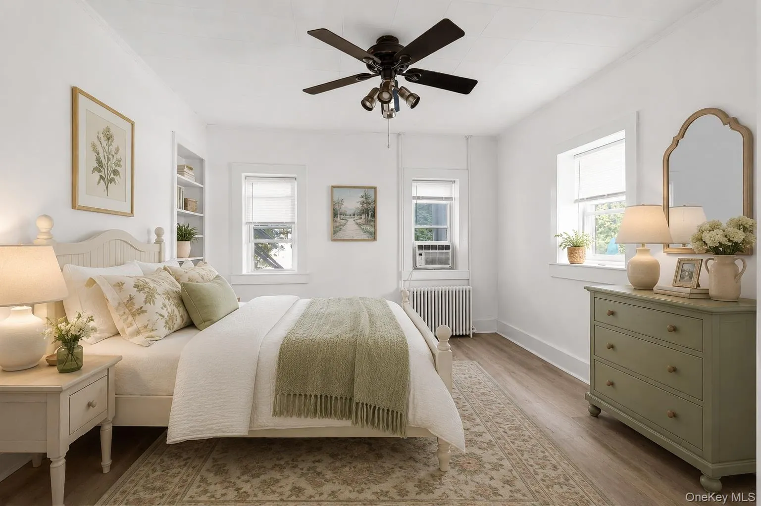 Virtually Staged. The main bedroom gets plenty of light, features built-in shelving and beautiful new floors. Virtually Staged. The main bedroom gets plenty of light, features built-in shelving and beautiful new floors.