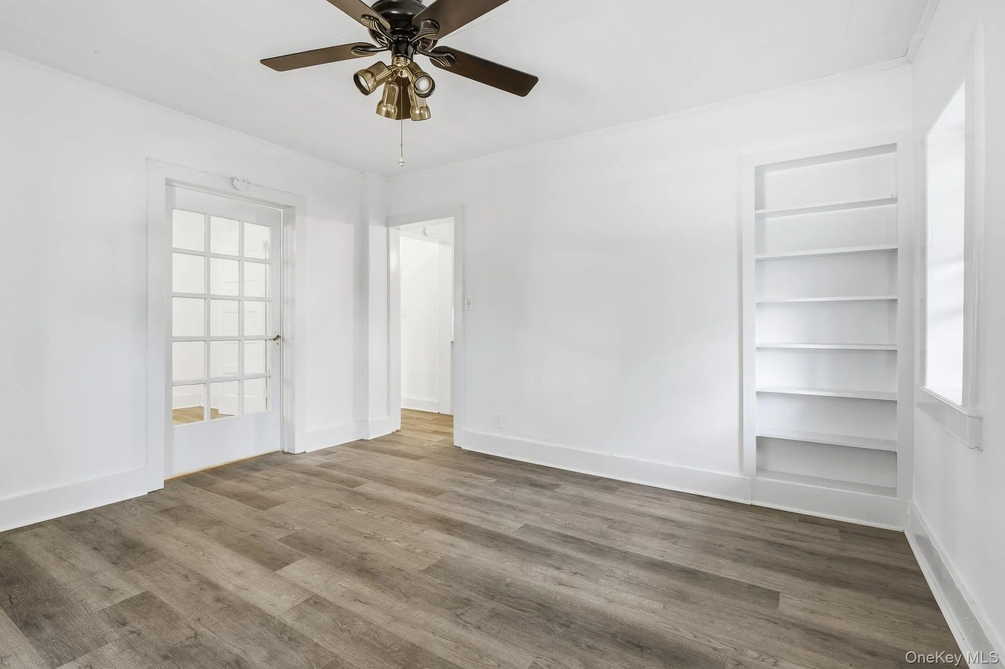 The main bedroom gets plenty of light, features built-in shelving and beautiful new floors. The main bedroom gets plenty of light, features built-in shelving and beautiful new floors.