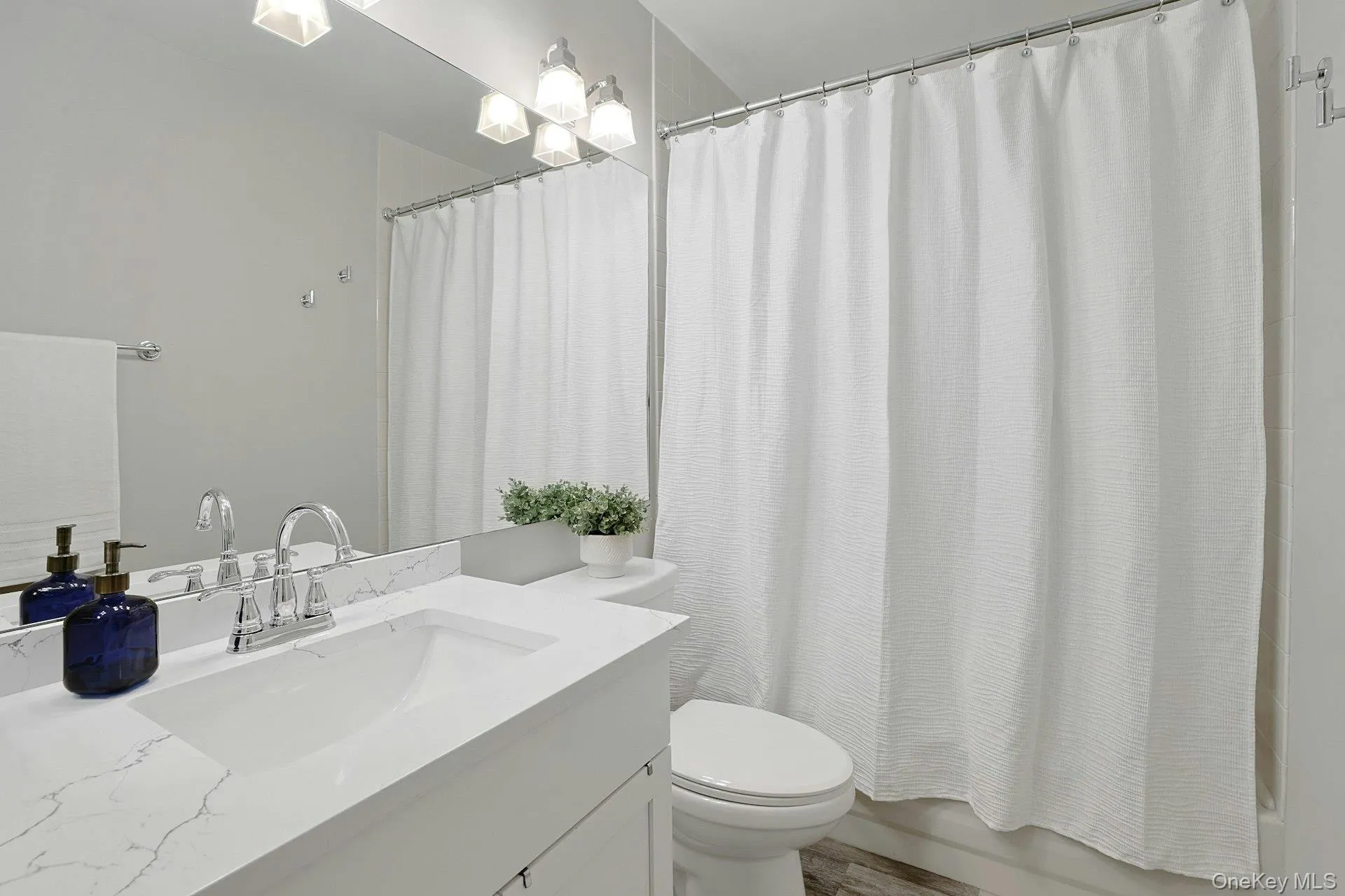 2nd floor bath with quartz counter, new vanity & toilet - completely renovated in 2022 2nd floor bath with quartz counter, new vanity & toilet - completely renovated in 2022