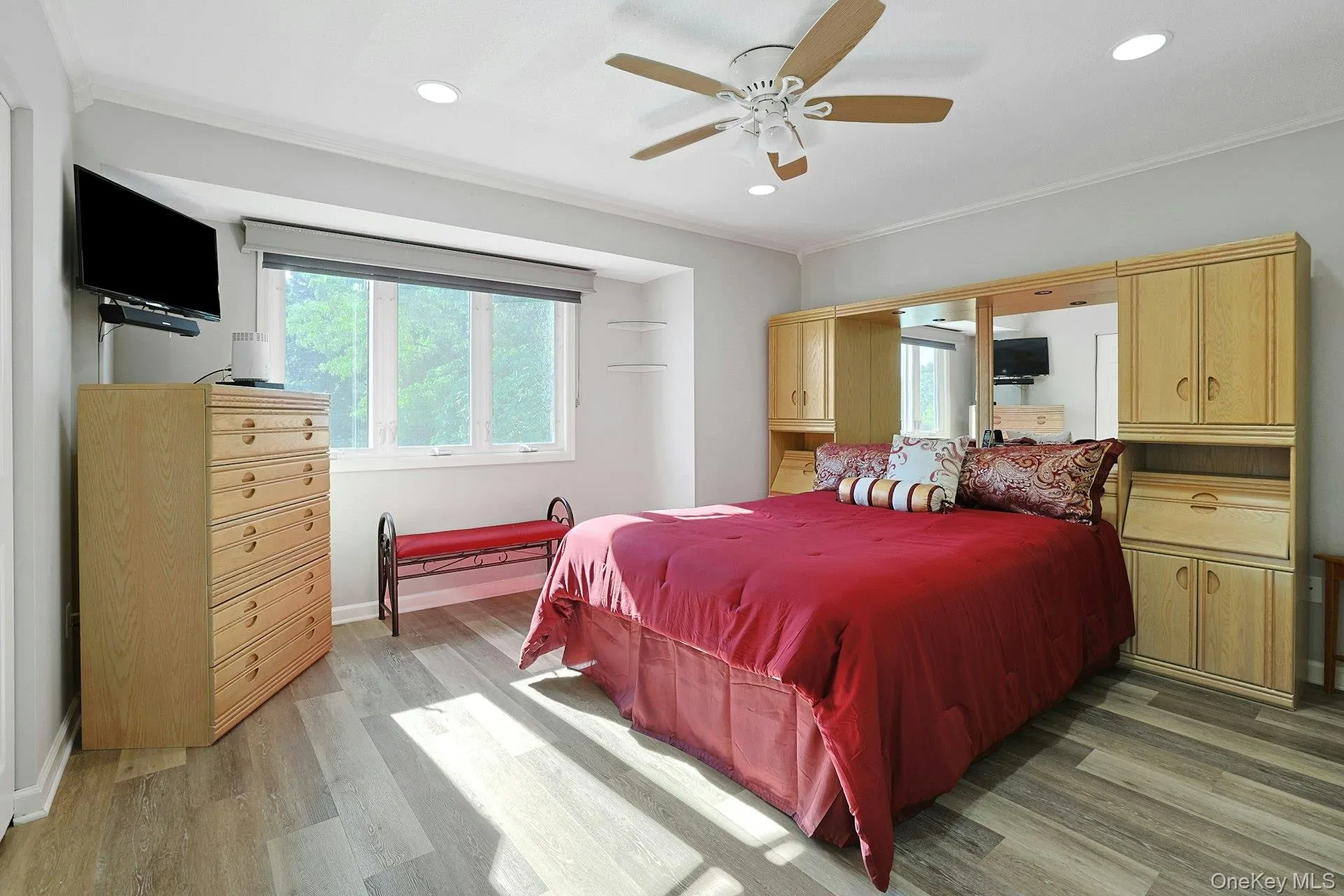primary bedroom with new wood-finish flooring, ceiling fan, custom blinds, oversized closets and private bath primary bedroom with new wood-finish flooring, ceiling fan, custom blinds, oversized closets and private bath