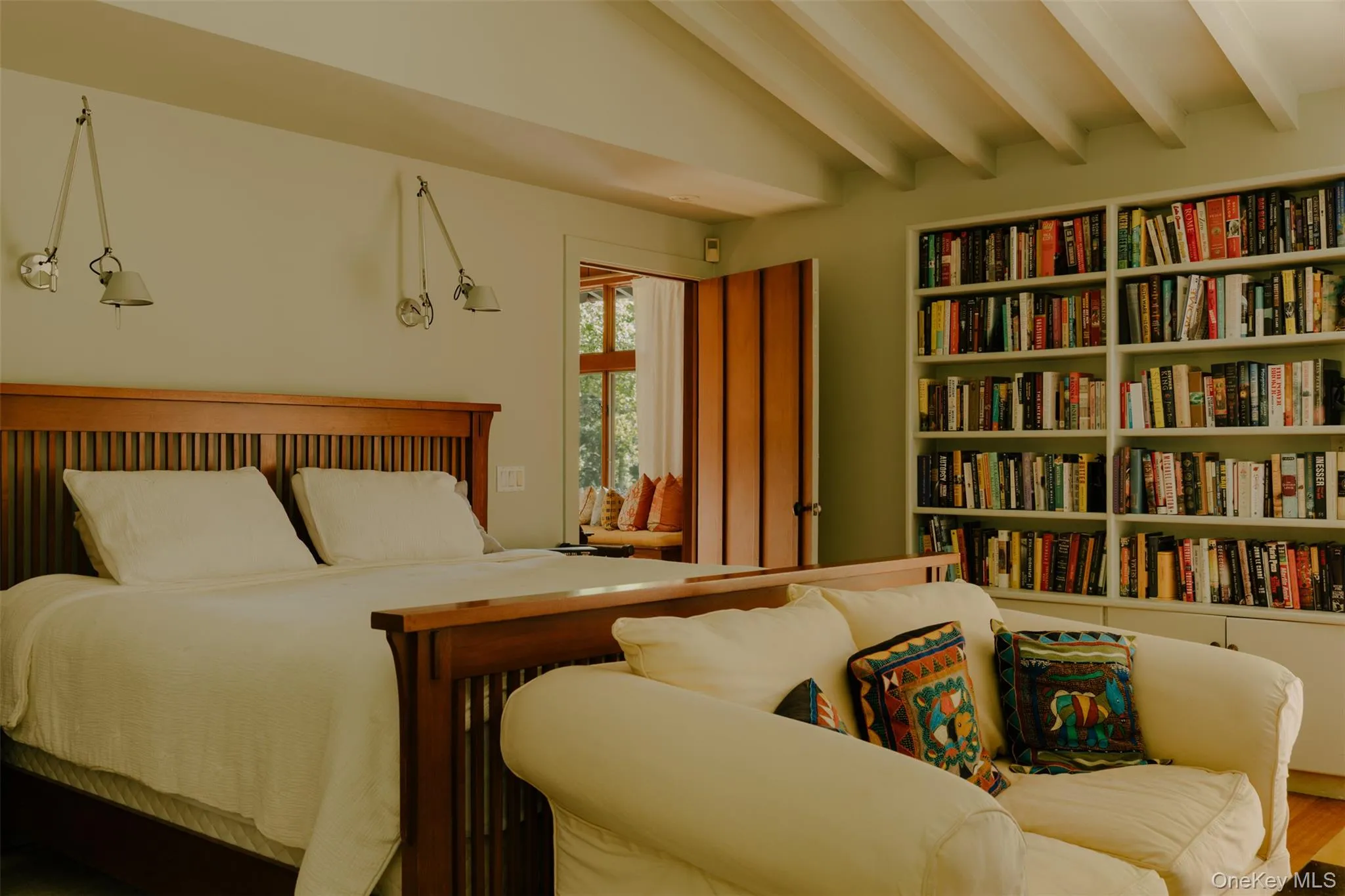 Built-in shelving, exposed ceiling beams, wood flooring Built-in shelving, exposed ceiling beams, wood flooring