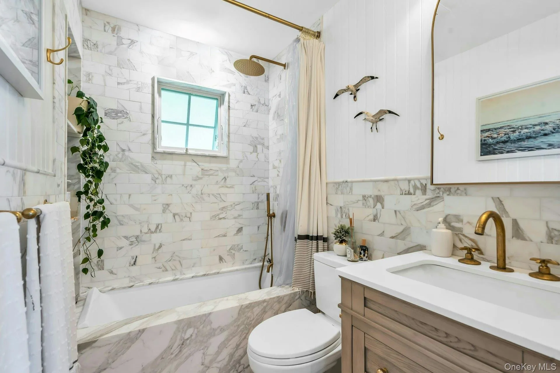 Luxurious and newly renovated full bathroom with marble, soaking tub, shower and Toto toilet Luxurious and newly renovated full bathroom with marble, soaking tub, shower and Toto toilet