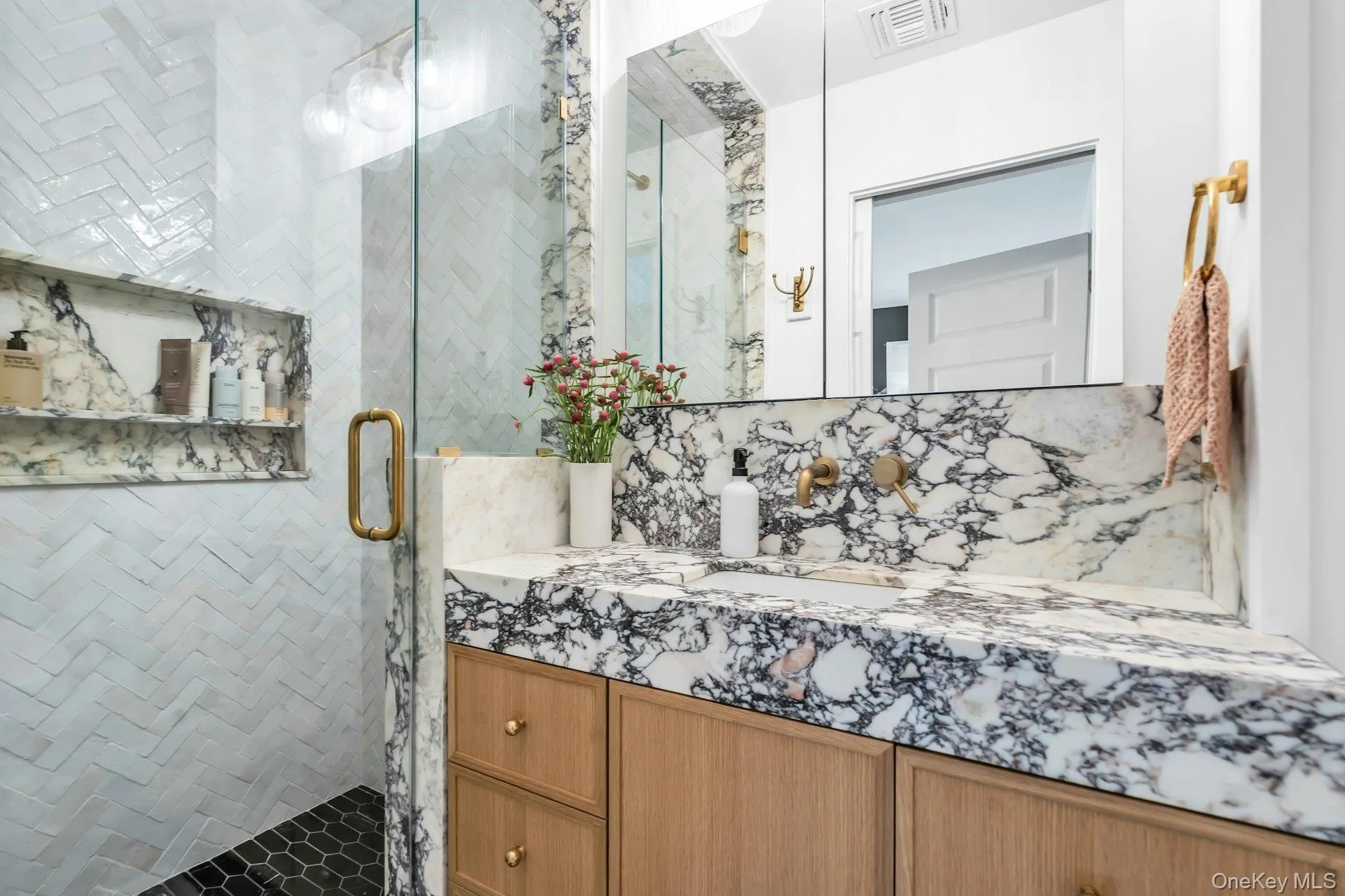 Newly renovated full bathroom with custom marble sink and tiled shower Newly renovated full bathroom with custom marble sink and tiled shower