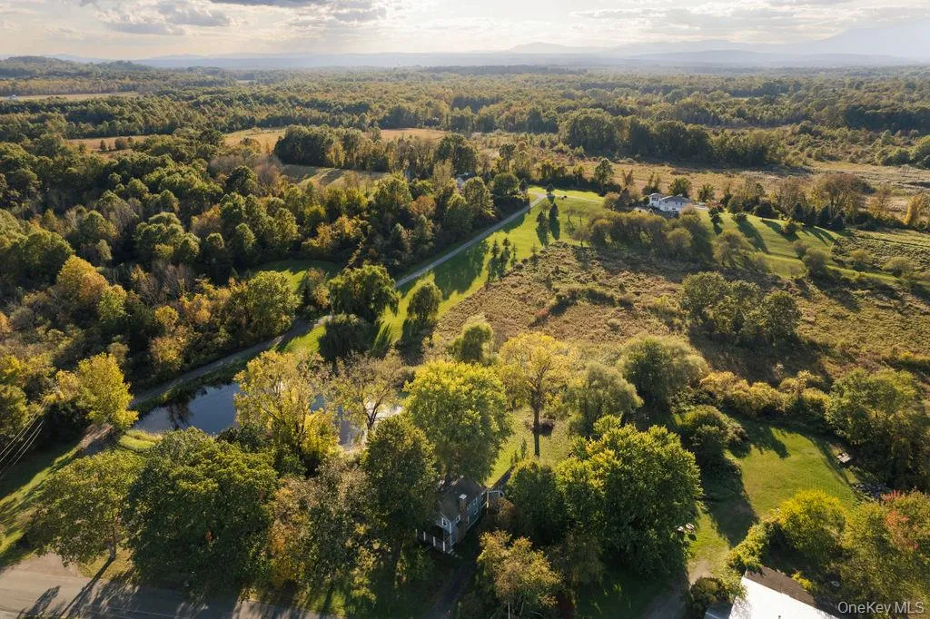 View of property location with a large body of water and a forest View of property location with a large body of water and a forest