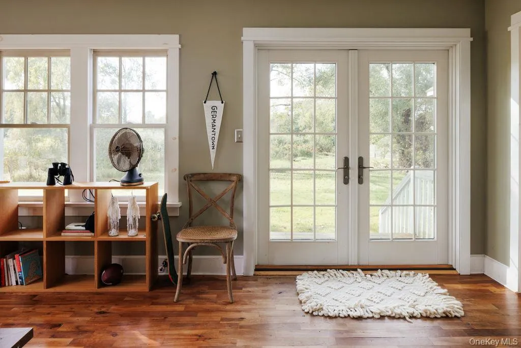 Sunroom with french doors to back yard Sunroom with french doors to back yard