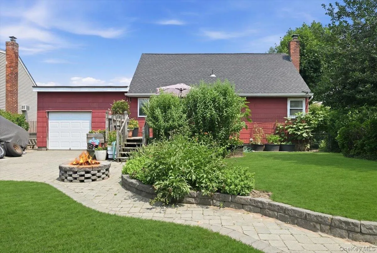 Backyard showing garage door for convenience,. Backyard showing garage door for convenience,.