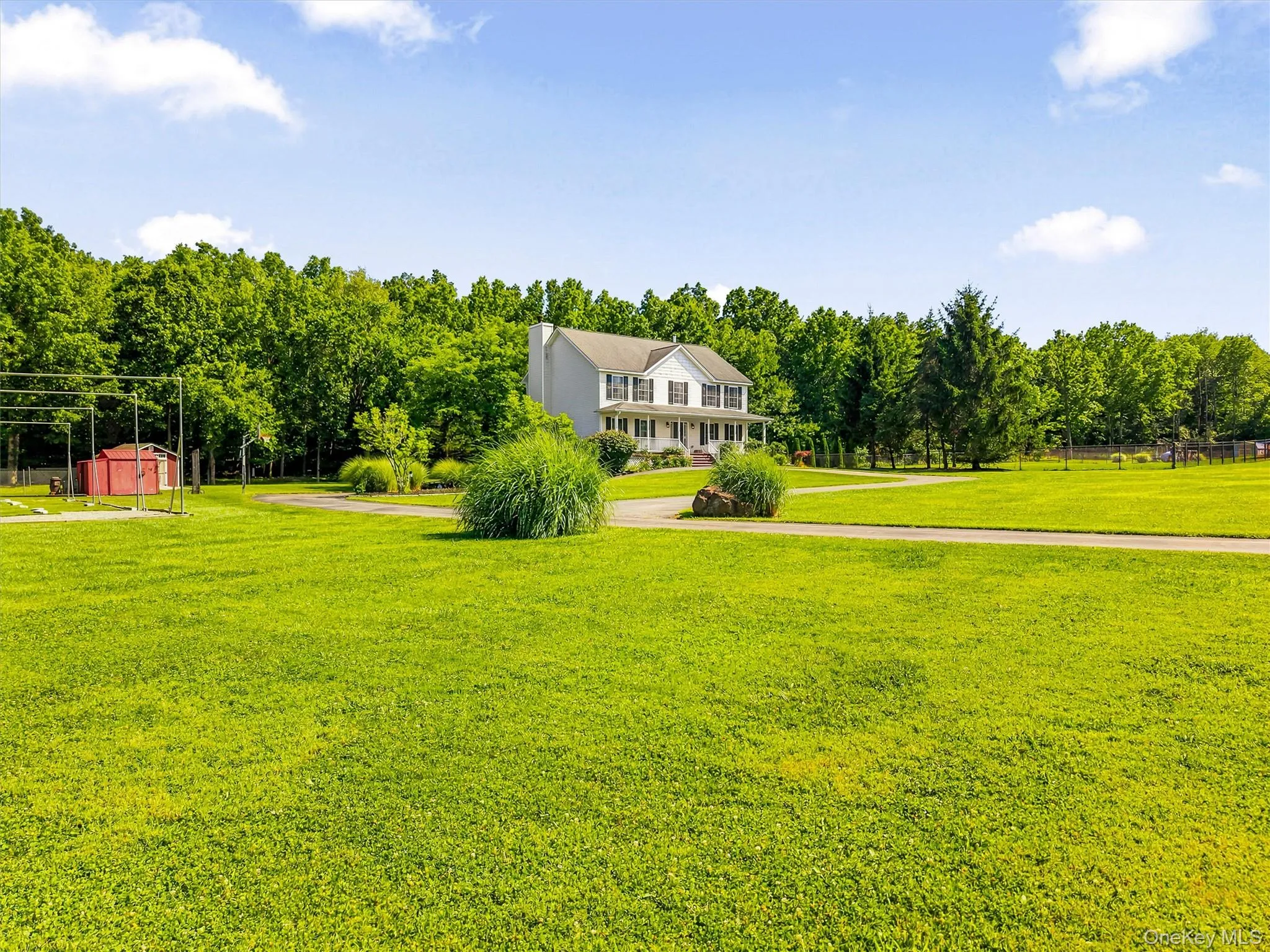 View of house looking across the expansive yard. View of house looking across the expansive yard.