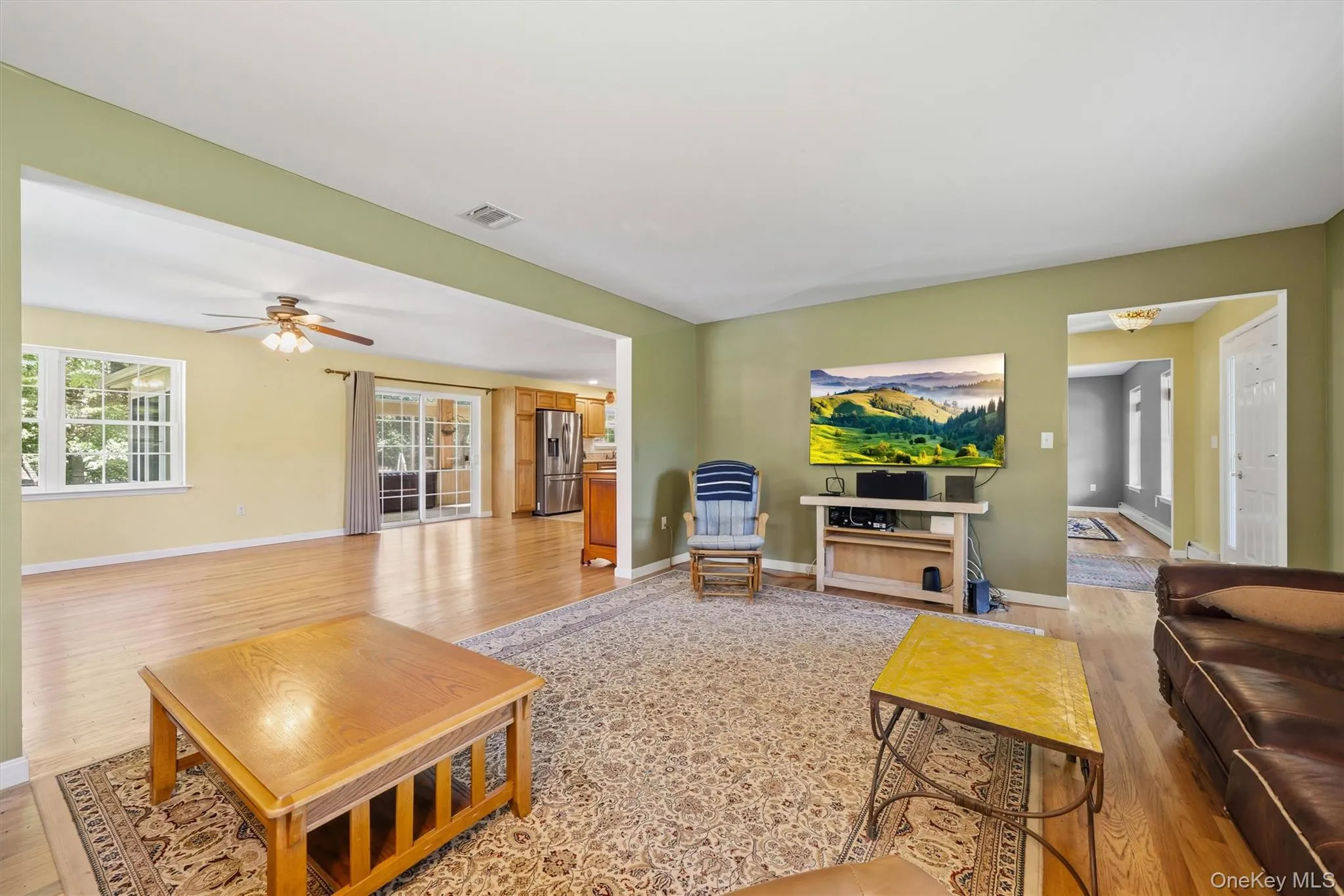 View from living room into the entry and family room. View from living room into the entry and family room.