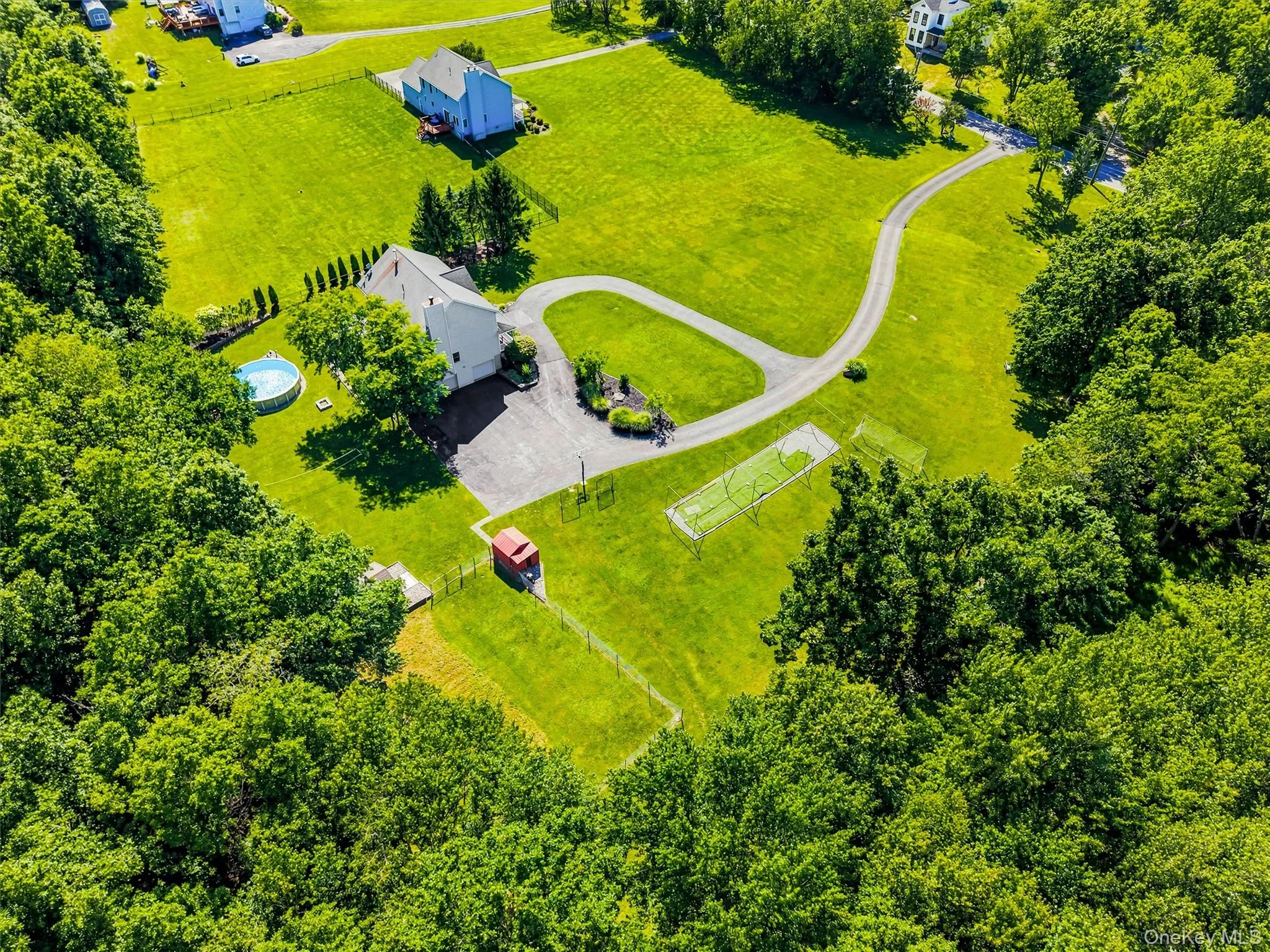 Aerial view of the side of the house and yard. Aerial view of the side of the house and yard.