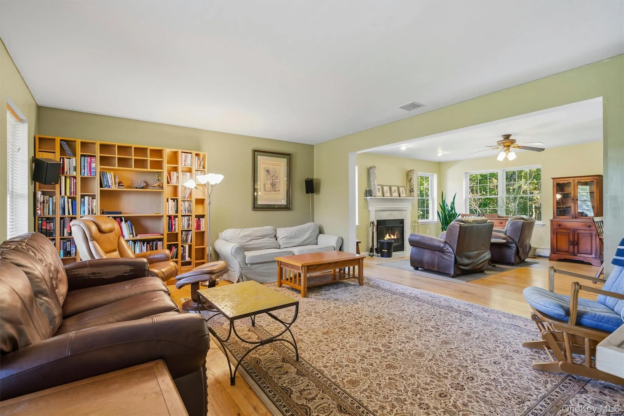 living room with view of the family room with fireplace. living room with view of the family room with fireplace.