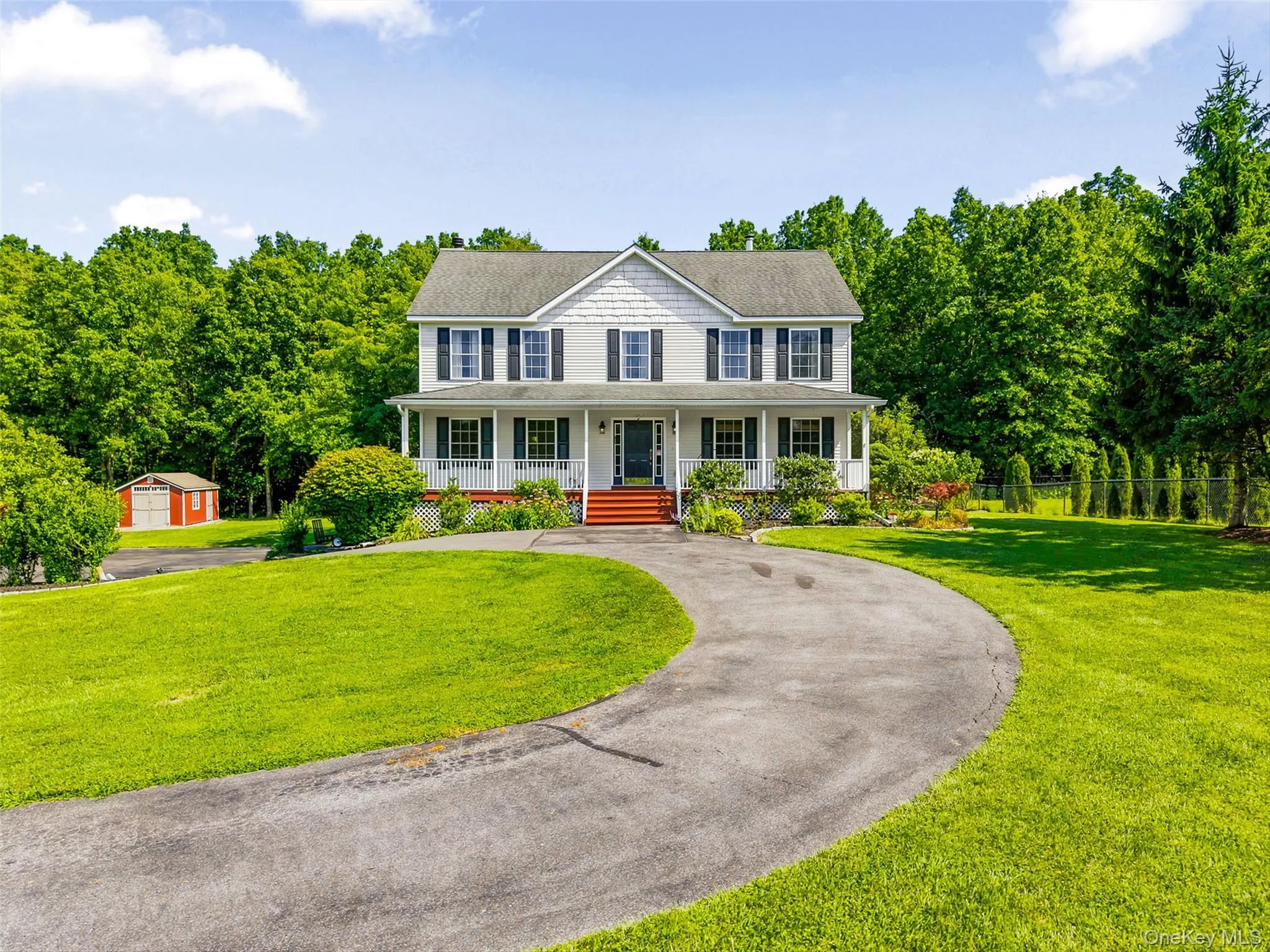 Front view with circular driveway. Front view with circular driveway.