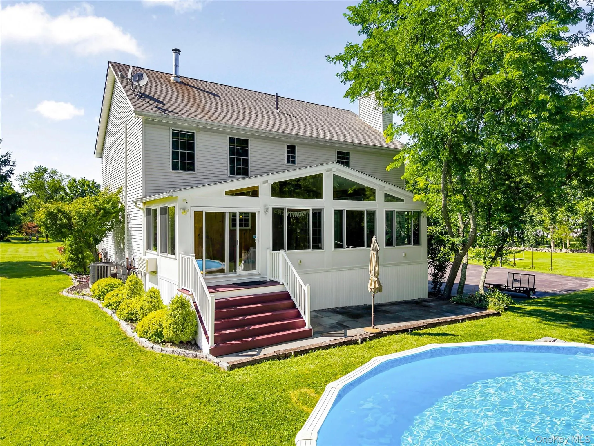 Rear view of home with pool. Rear view of home with pool.
